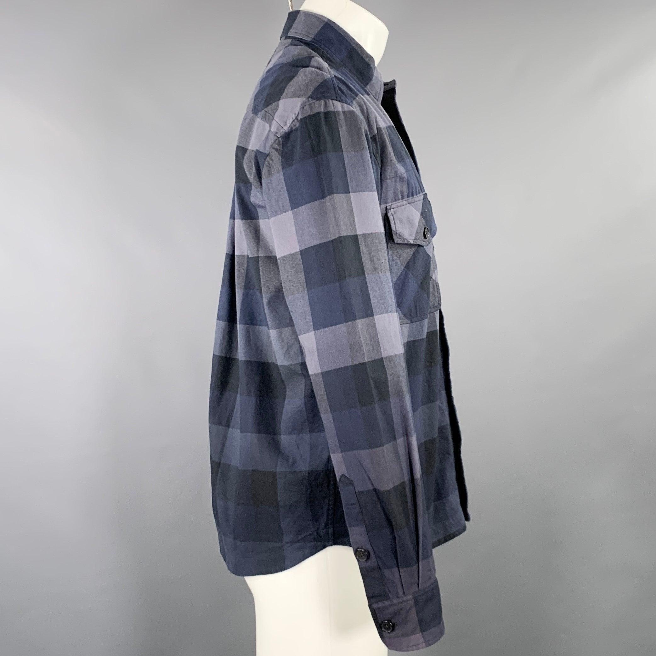 KENZO long sleeve shirt
in a navy and grey cotton woven fabric featuring a checkered pattern, two buttoned pockets, and button closure. Excellent Pre-Owned Condition. 

Marked:   S 

Measurements: 
 
Shoulder: 19 inches Chest: 40 inches Sleeve: 24