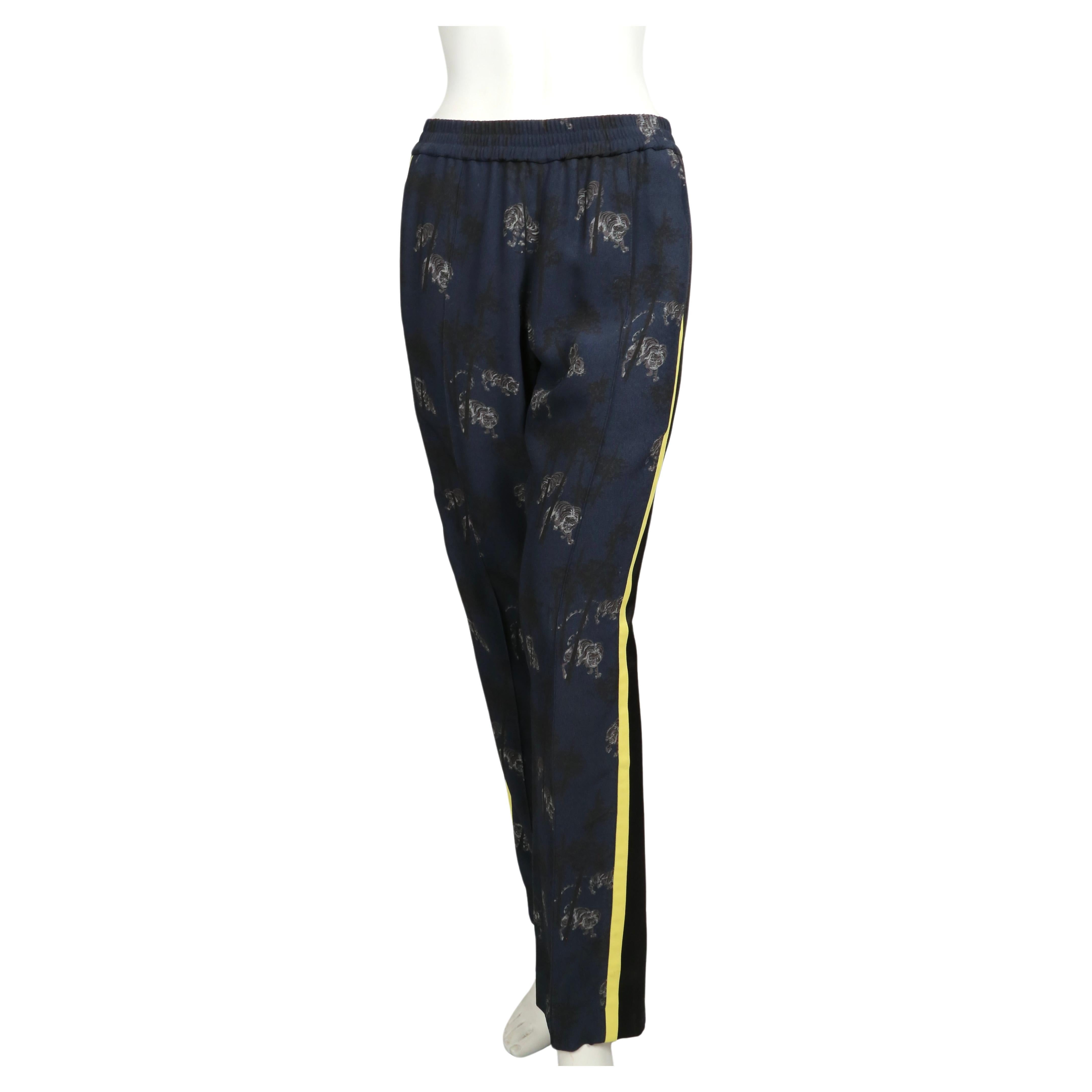 Tiger printed track pants with striped side by Kenzo. French size 36. Pants were not clipped on French size 36 mannequin. Approximate measurements: 26