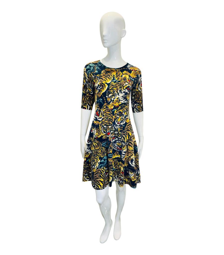 Kenzo Tiger Print Wool Dress

Multicoloured skater dress designed with signature tiger prints.

Featuring above-the-elbow sleeves, round neckline and flared skirt.

Size – L

Condition – Very Good

Composition – 80% Wool, 17% Polyamide, 3% Elastane