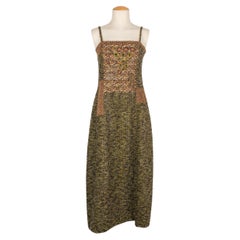 Abito in tweed di Kenzo nei toni del verde, dell'oro e del marrone