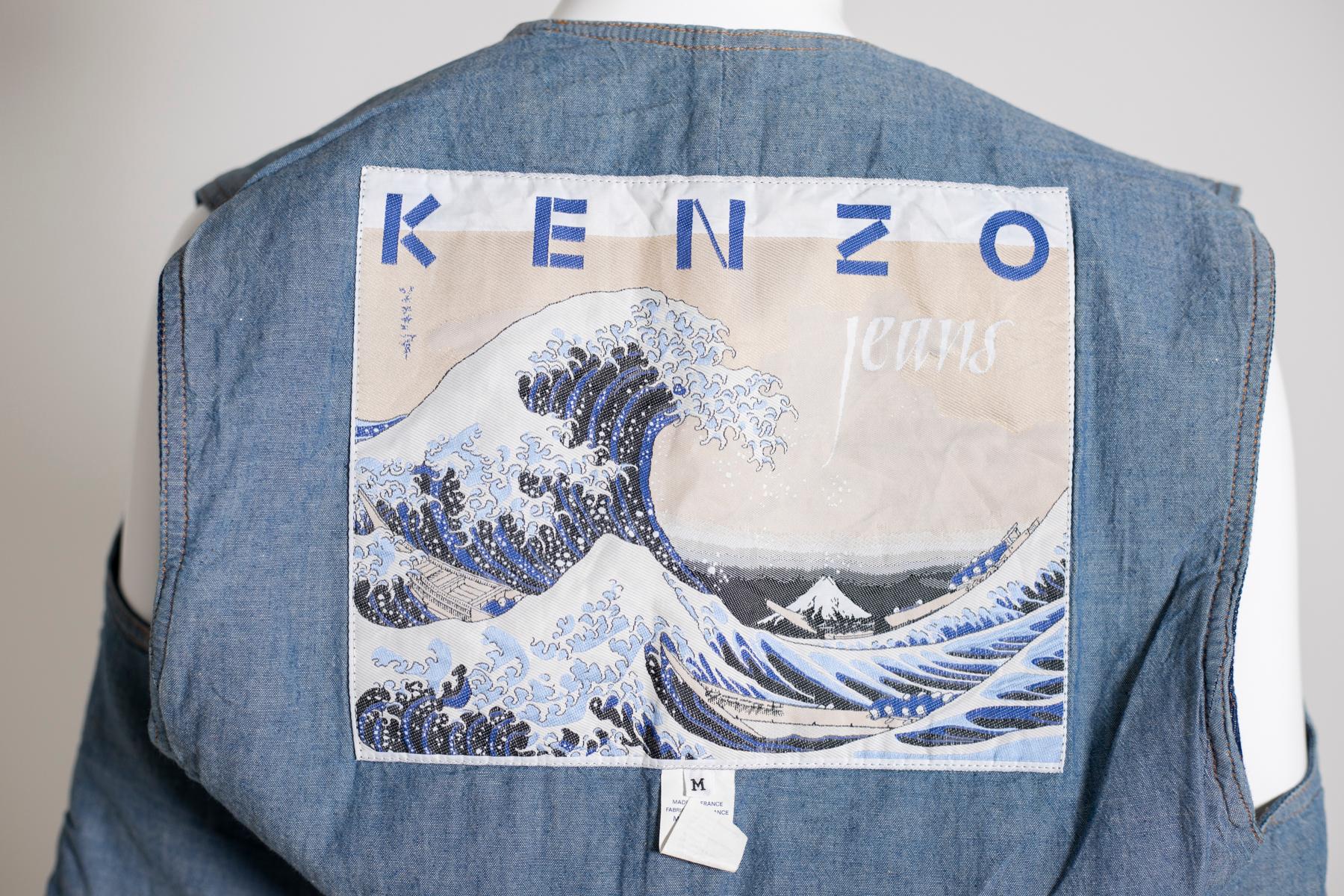 Kenzo limited edition waistcoat in jeans with Bohemian pattern embroidered on the front, from 1990s. The vest is part of the collection dedicated to the famous Japanese artist Hokusai, in fact, inside the vest we can admire his most famous work: The