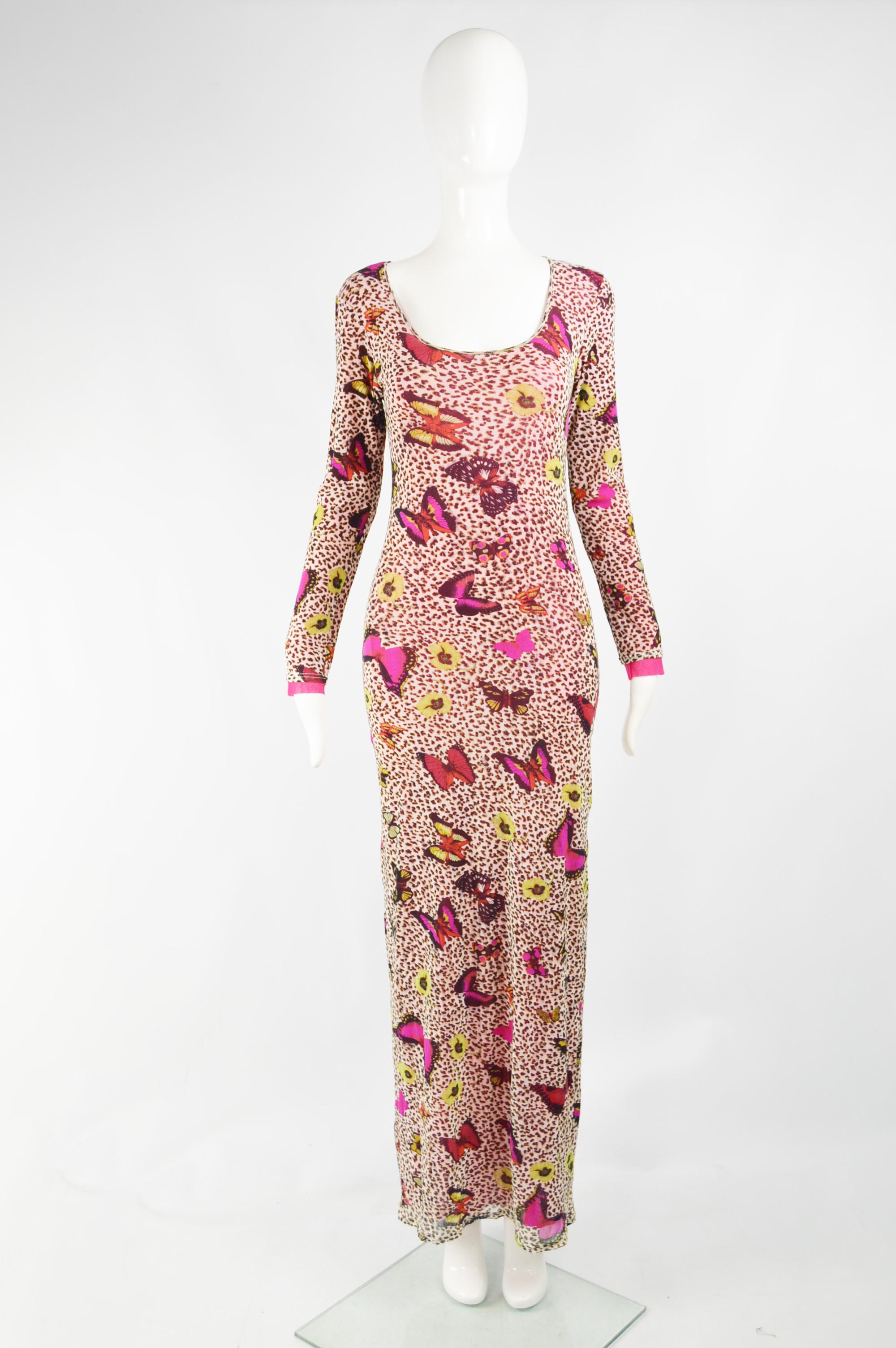 A fabulous and rare vintage womens Kenzo maxi dress from the 90s in a leopard and butterfly print sheer mesh fabric that has a further pink mesh lining. Perfect for the day in spring and summer or worn at a party. 

Size: Marked vintage L but fits a