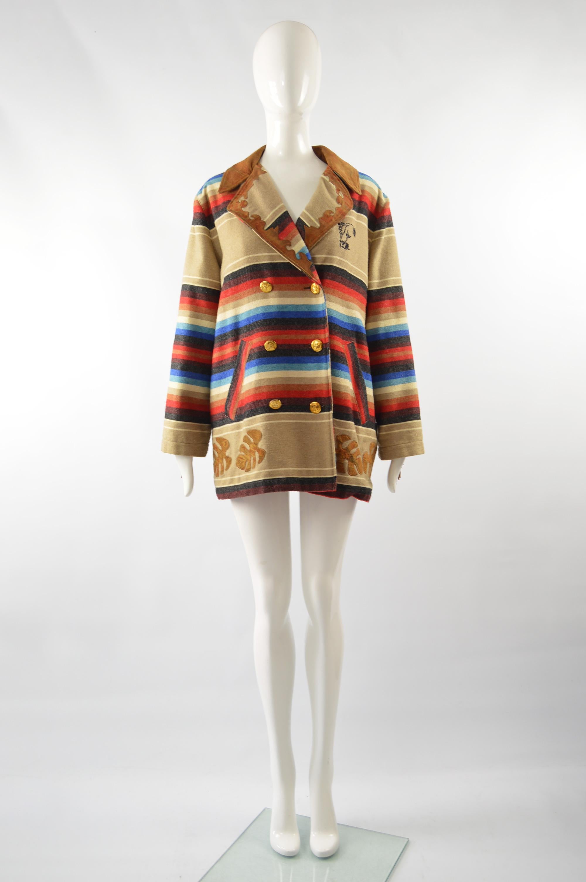 An amazing vintage Kenzo oversized jacket from the late 80s in a wool blend with a brown leather suede fringe trim and an ethnic style striped pattern throughout. 

Size: Marked M but this gives an oversized fit. 
Bust - 46” / 117cm
Waist - 44” /