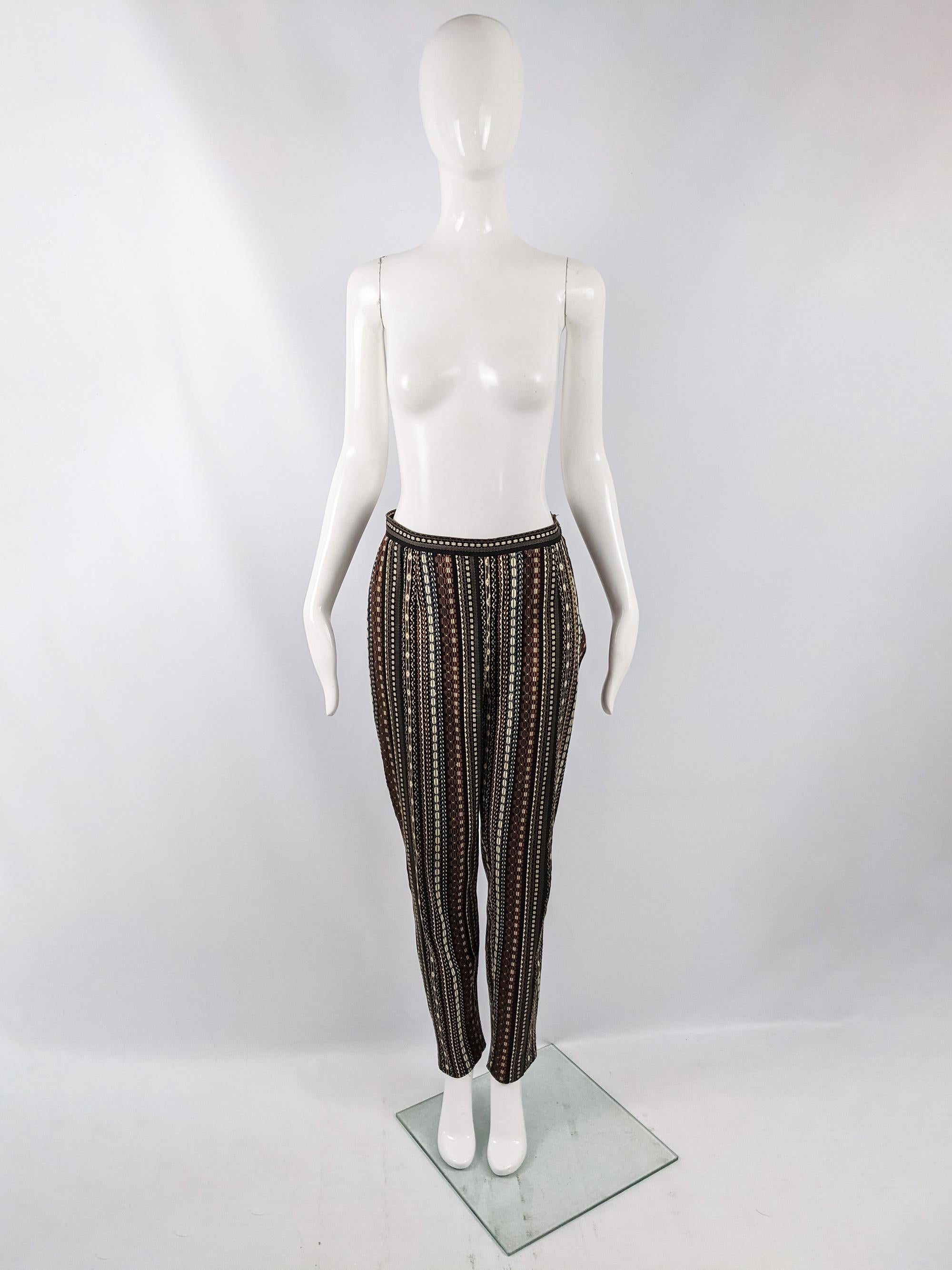 A chic pair of vintage Kenzo cigarette style pants from the 90s. Made in France, in a woven tapestry / jacquard fabric with a high waist and tapered leg. 

Size: Marked 42
Waist - 28” / 71cm
Hips - 38” / 96cm
Rise - 12” / 30cm
Inside Leg - 29” /