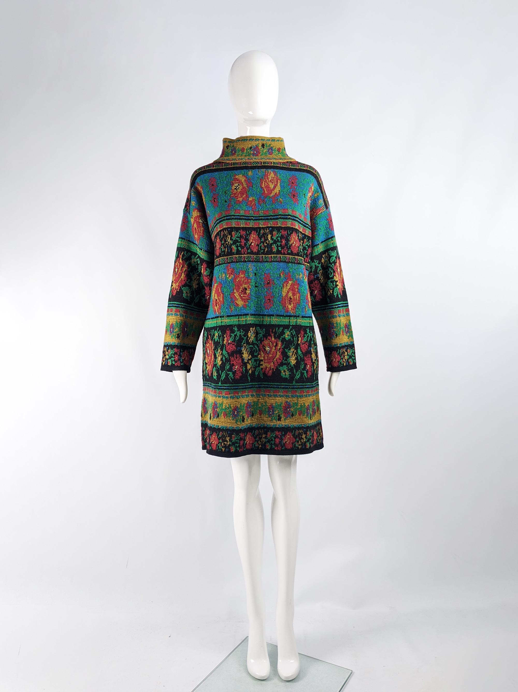 A fabulous and rare vintage sweaterdress from the late 80s by iconic fashion designer, Kenzo. In a wool knitted fabric with a multicolored floral pattern throughout in hues of mustard, gold and turquoise. It has a high neck and shift style