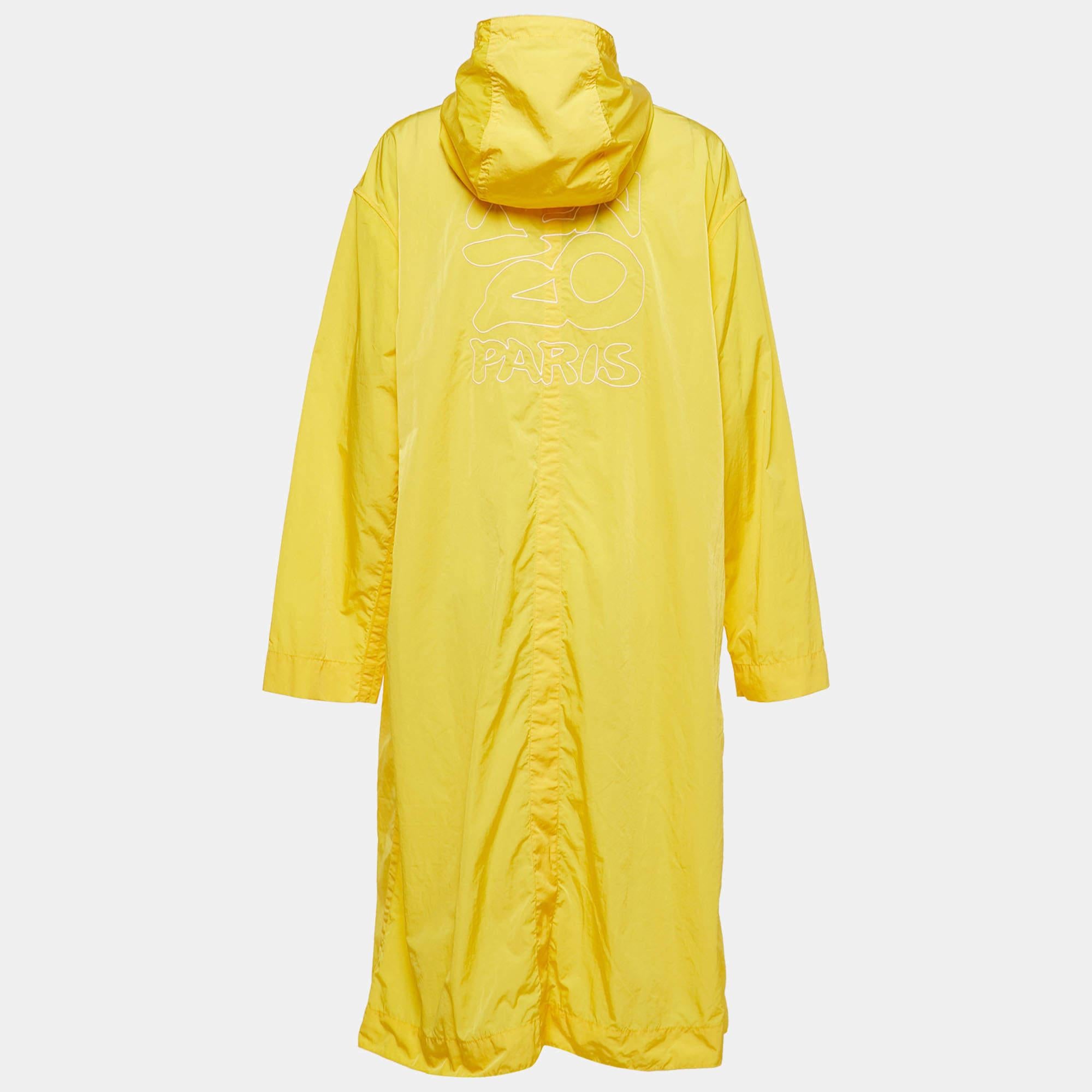 The Kenzo Raincoat is a stylish and functional outerwear piece. Made from durable nylon, this raincoat features a bright yellow color that adds a pop of color to rainy days. It has a button front closure for easy wear and a hood for added protection