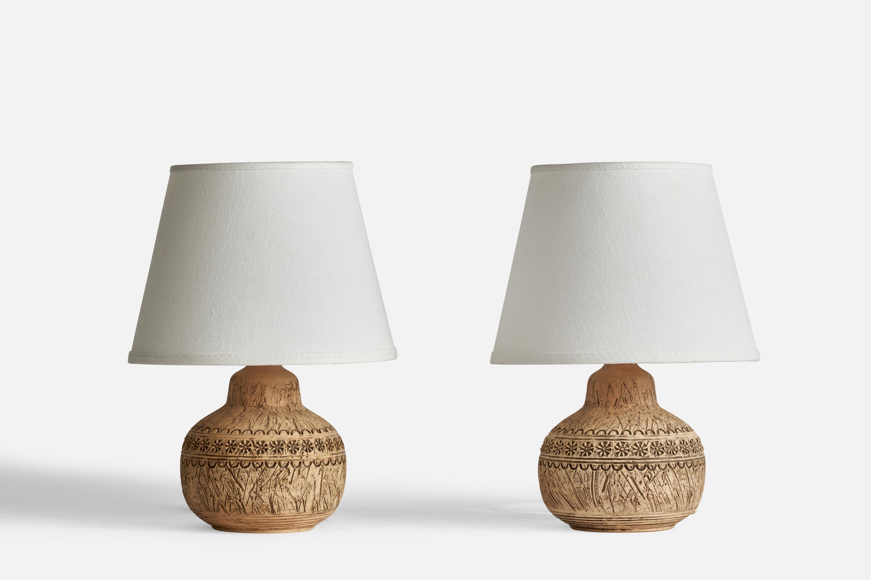 A pair of table lamps designed and produced by Keramik Olle, Gränna, Sweden, c. 1960s.

Dimensions of Lamp (inches): 7.25” H x 5” Diameter
Dimensions of Shade (inches): 5.25” Top Diameter x 8” Bottom Diameter x 6” H
Dimensions of Lamp with Shade