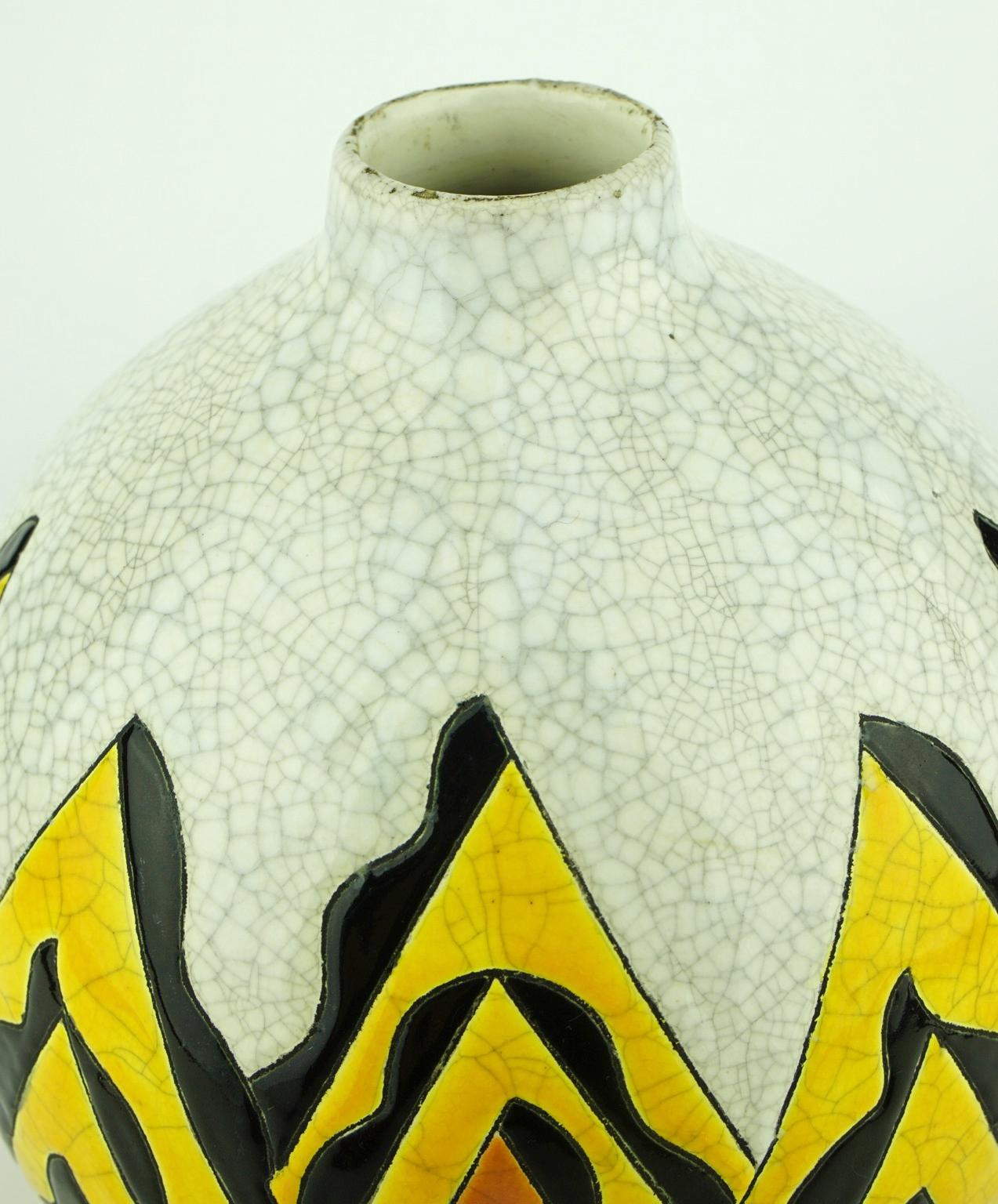 The design of this abstract Art Deco vase evoques perhaps volcanos. An example of Avant Garde in Art Deco ceramics. Marks: D 1209.

Material: Crackled enamel on earthenware.