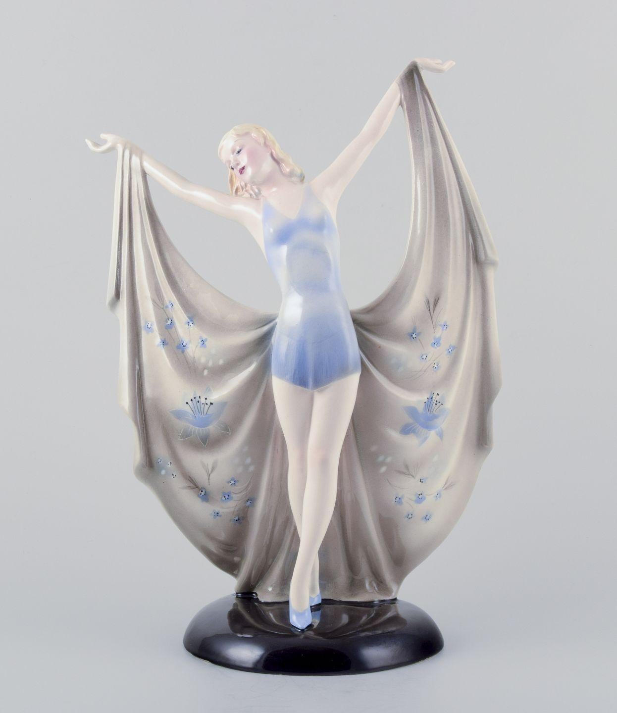 Keramos, Austria. Large ceramic Art Deco sculpture of female dancer on plinth.