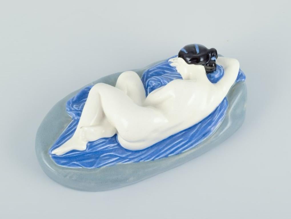 Glazed Keramos, Austria. Rare Art Deco ceramic sculpture of a reclining nude woman. For Sale