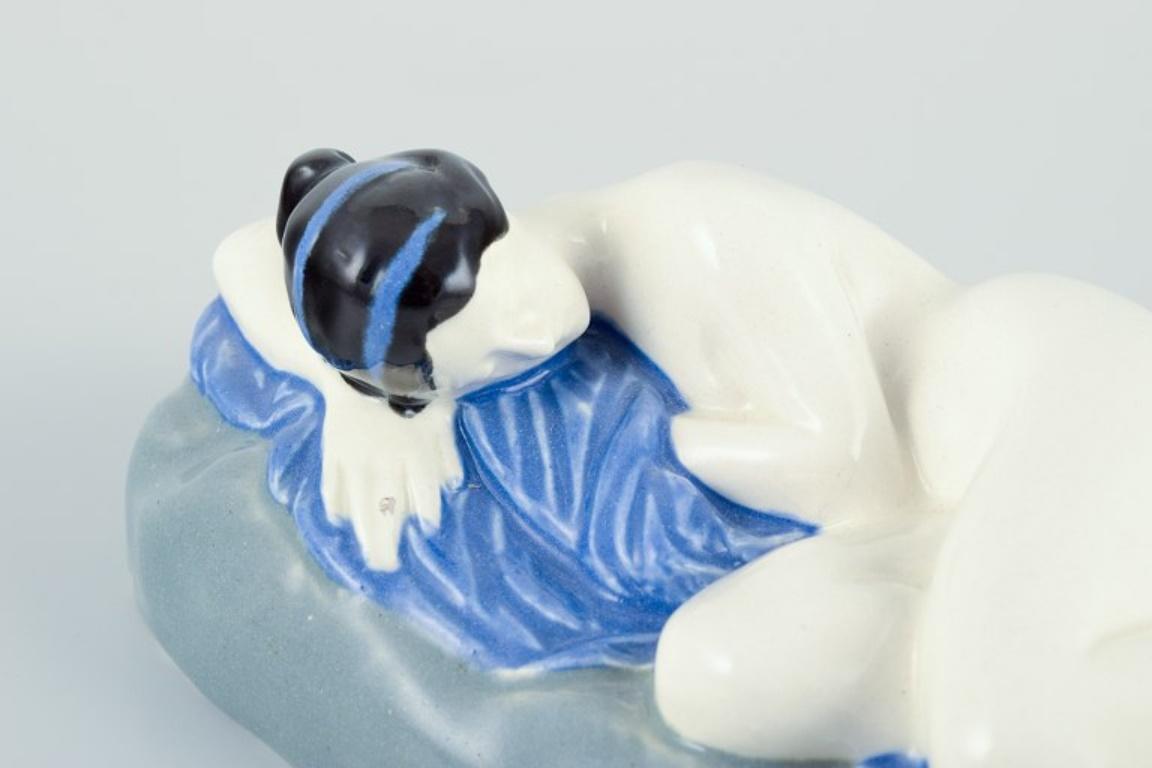 Keramos, Austria. Rare Art Deco ceramic sculpture of a reclining nude woman. In Good Condition For Sale In Copenhagen, DK