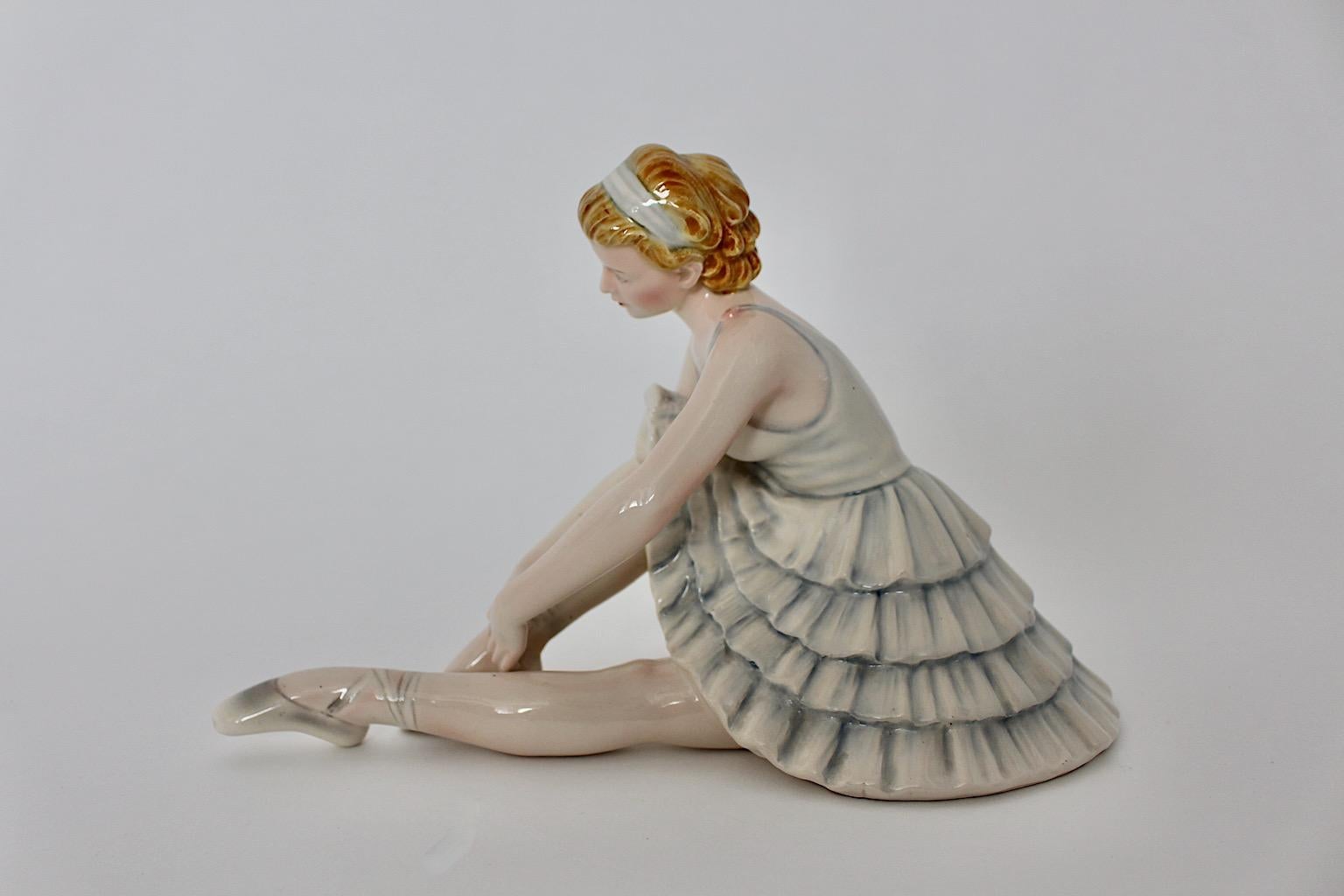 Ceramic figurine dancer ballerina with pastel blue ruffled dress and ballet flats by Stefan Dakon for Keramos, circa 1949.
Amazing and elegant figurine in pastel blue color from ceramic with glossy finish.

Stamped Knight Keramics made in Austria