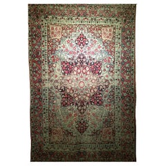 Used 19th Century Persian Kerman Lavar Area Rug in Floral Design in Red, Ivory, Black