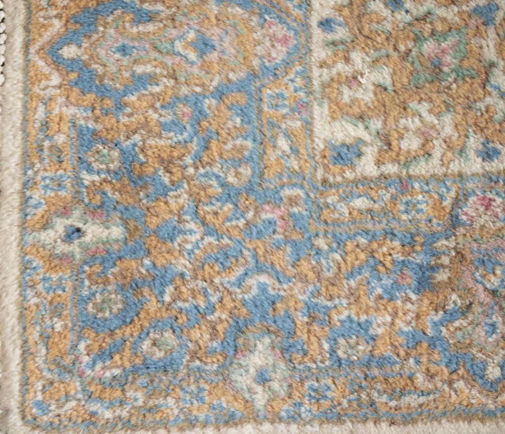 Modern Kerman beige and blue wool carpet. Scattered areas of soiling. Provenance: Removed from the Fifth Avenue residence of the MacArthur Family.

Dealer: S138XX