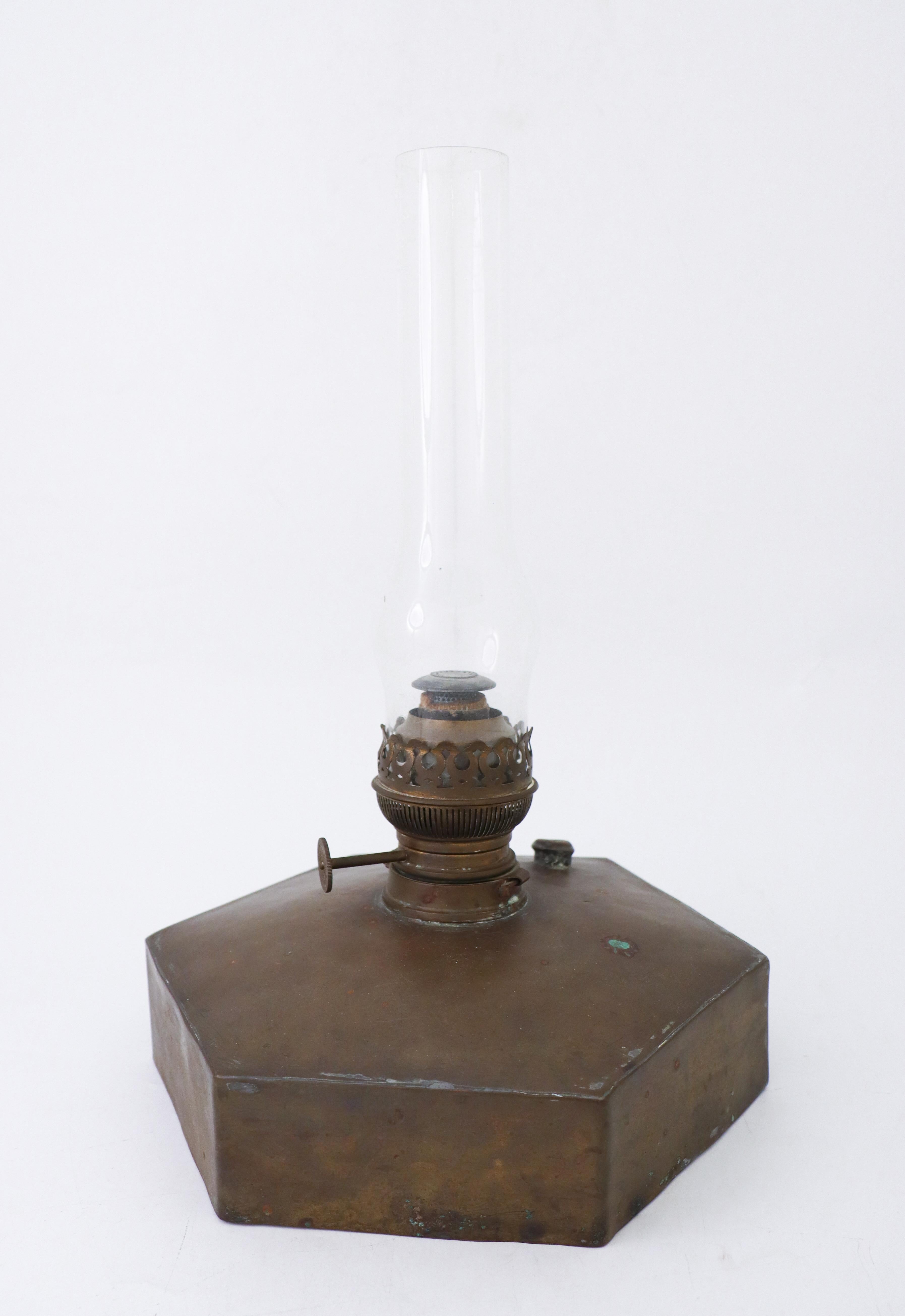 A kerosene lamp made in brass probably from the late 19th century. It is 41 cm high (including the glass) and it is 29 cm in diameter. It is in very good condition except from some minor marks in the brass.