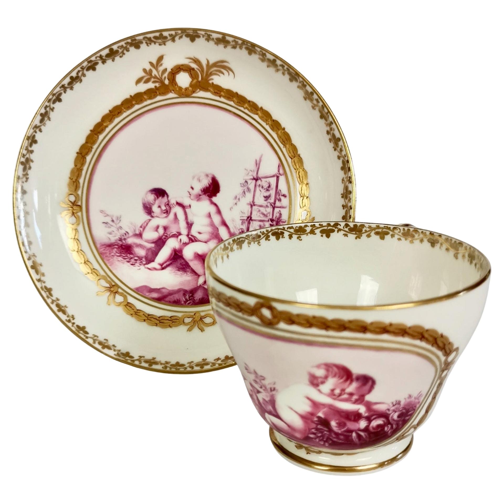 Kerr & Binns Worcester Porcelain Cup and Saucer, Puce Putti Playing, circa 1855