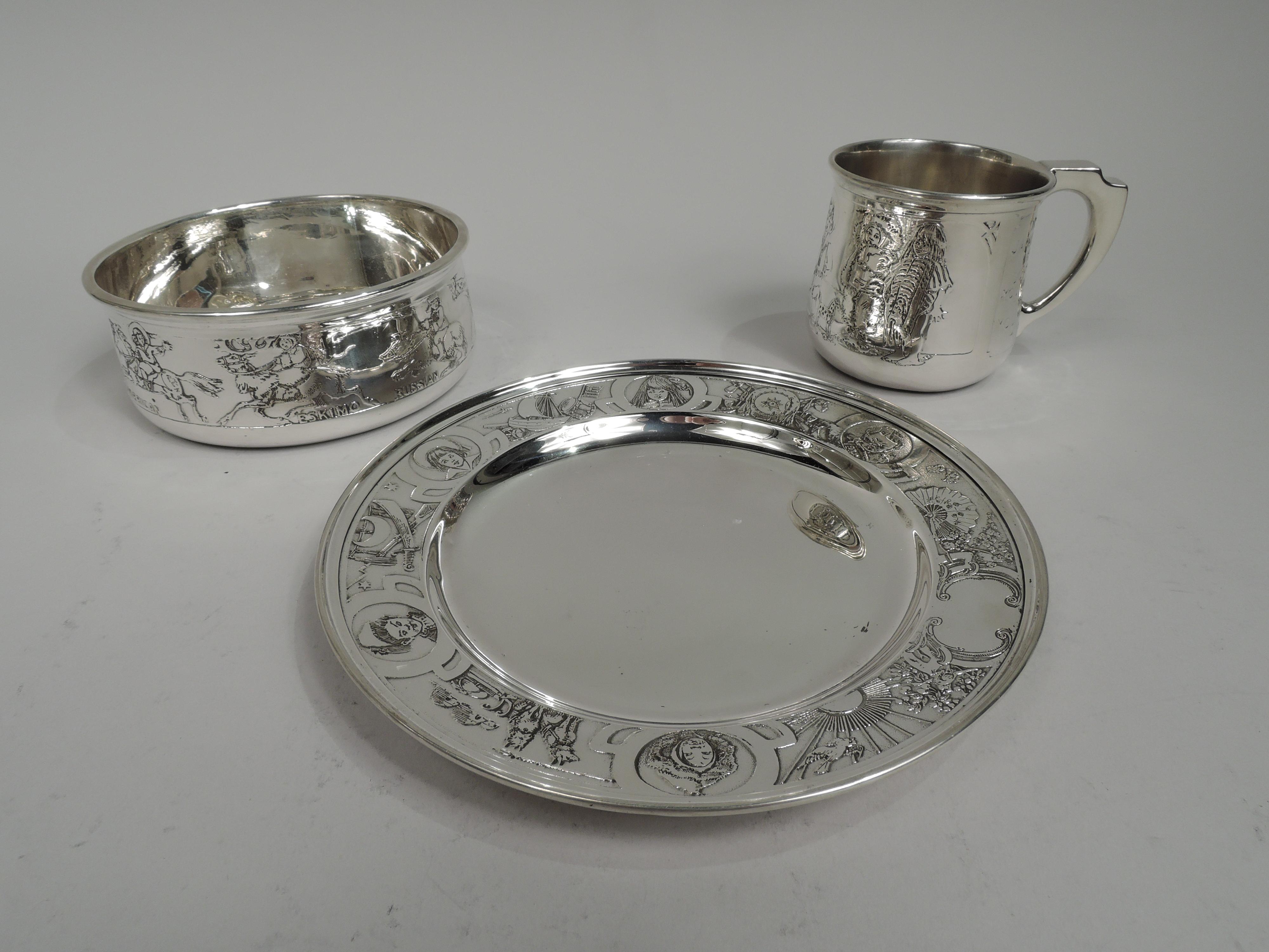 Turn-of-the-century sterling silver baby set rich in period assumptions. Made by William B. Kerr in Newark. This set comprises cup, bowl, and plate.

Cup has acid-etched frieze depicting sailor-suited, flag-holding, all-American boy with exotic