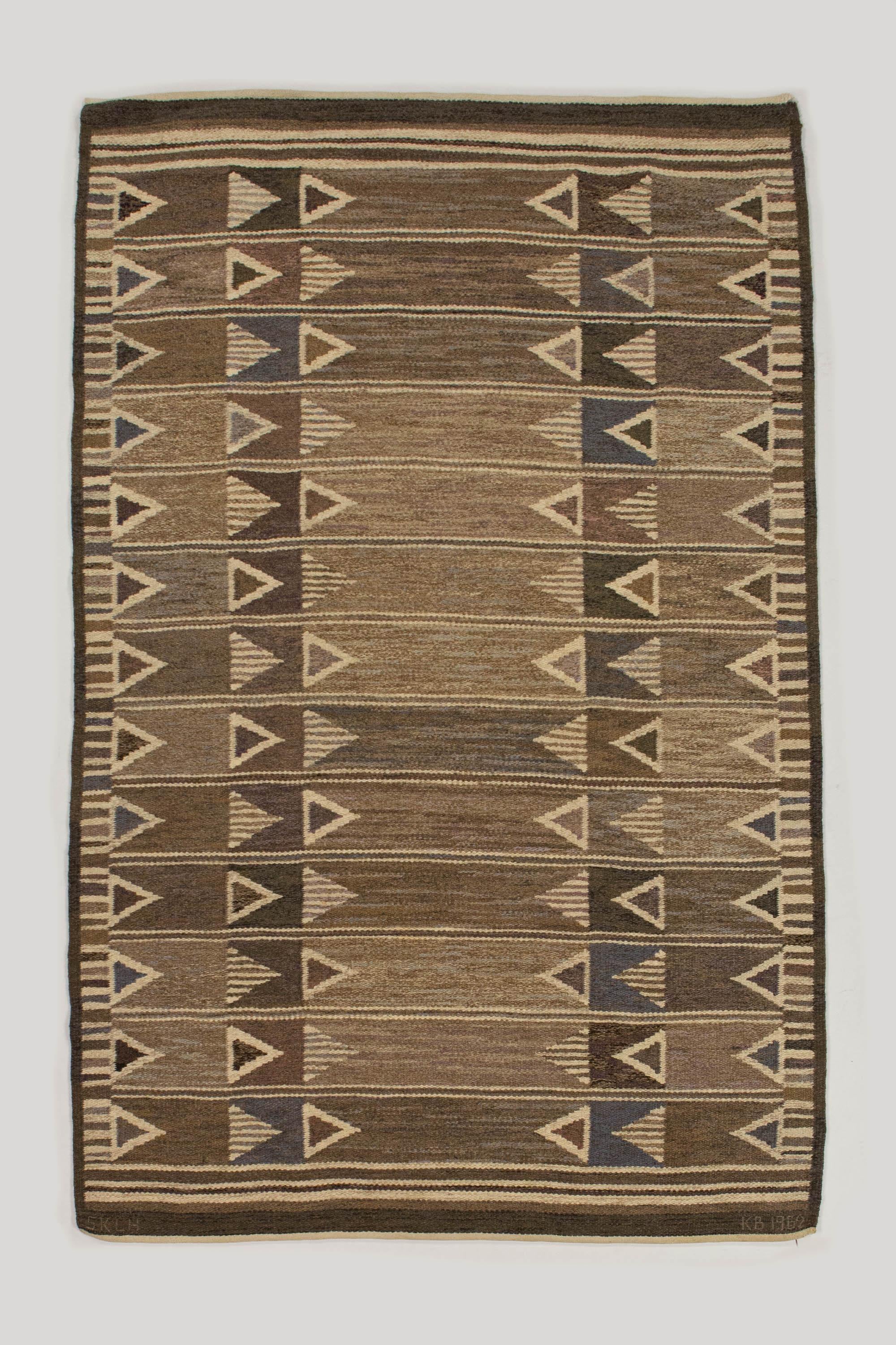 Kerstin Butler Swedish Rug by Södra Kalmar Läns Hemslöjd - Signed KB, 1962, SKLH

This early hand woven, signed KB, and dated 1962 piece was designed by the much sought after Kerstin Bulter during her time with Södra Kalmar Läns Hemslöjd is an an