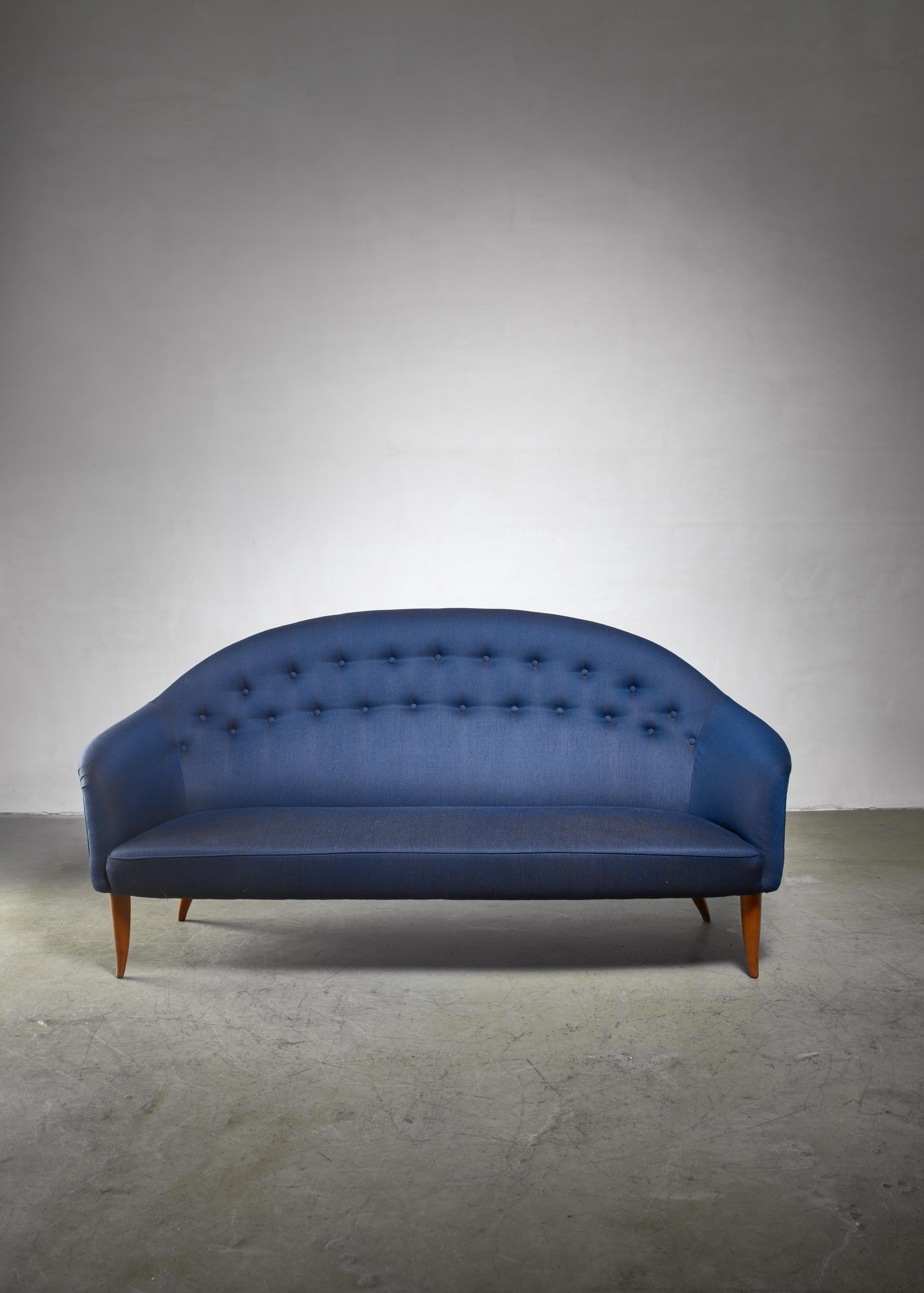 A three-seater 'Paradiset' sofa from the 'Triva' series by Kerstin Hörlin-Holmquist for Nordiska Kompaniet. It has been newly upholstered with a blue 'Balder' fabric by Fanny Arenden.