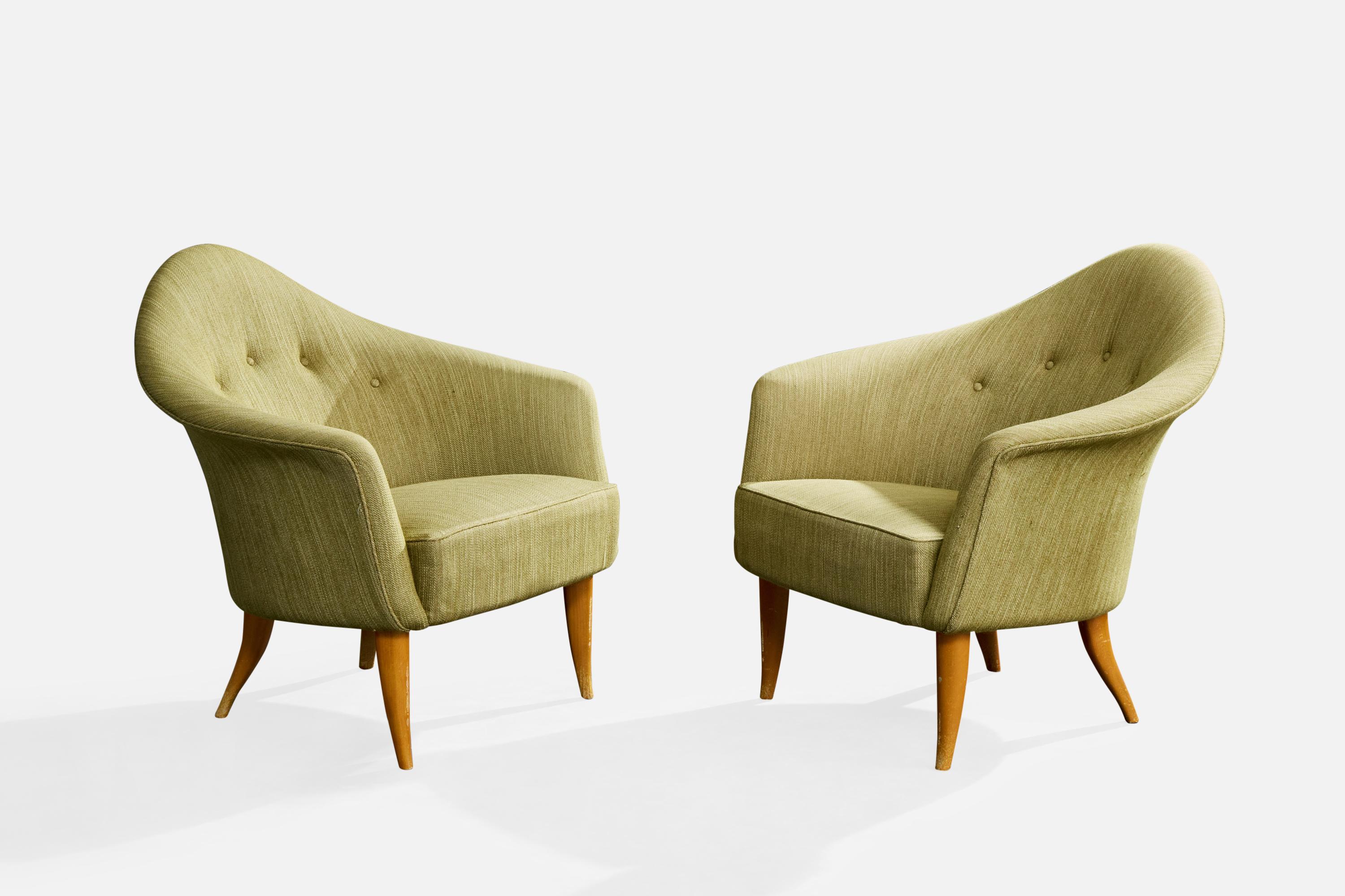 A pair of green fabric and wood lounge chairs designed by Kerstin Hörlin Holmquist and produced by Nordiska Kompaniet, Sweden, 1950s.

Minor imperfections to vintage fabric. Moderate wear to feet.

Overall Dimensions (inches): 29.5
