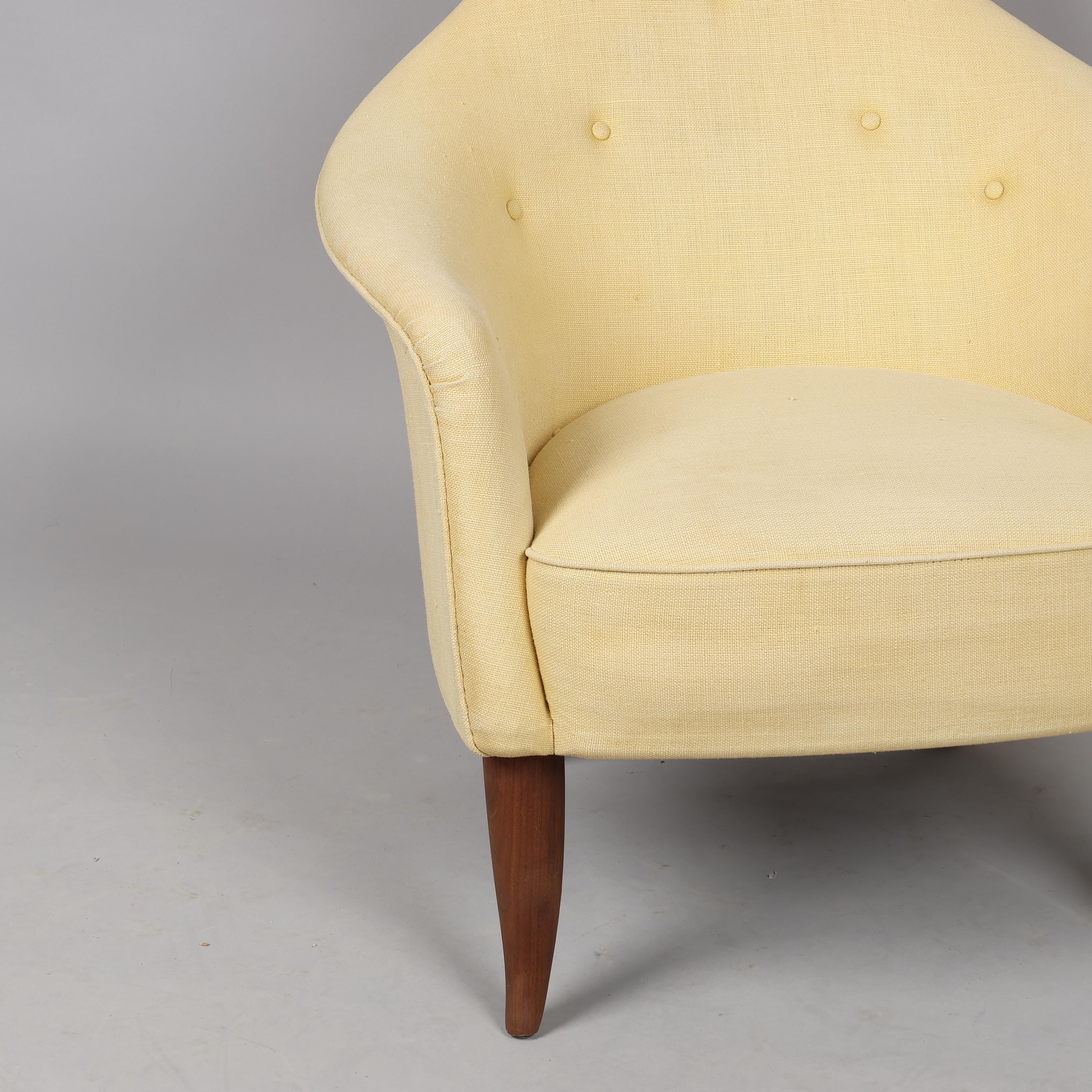 KERSTIN HÖRLIN-HOLMQUIST (1925-97) 'Stora Eva' armchair from the series' Paradiset', yellow cover with walnut legs.
Lounge chair model 