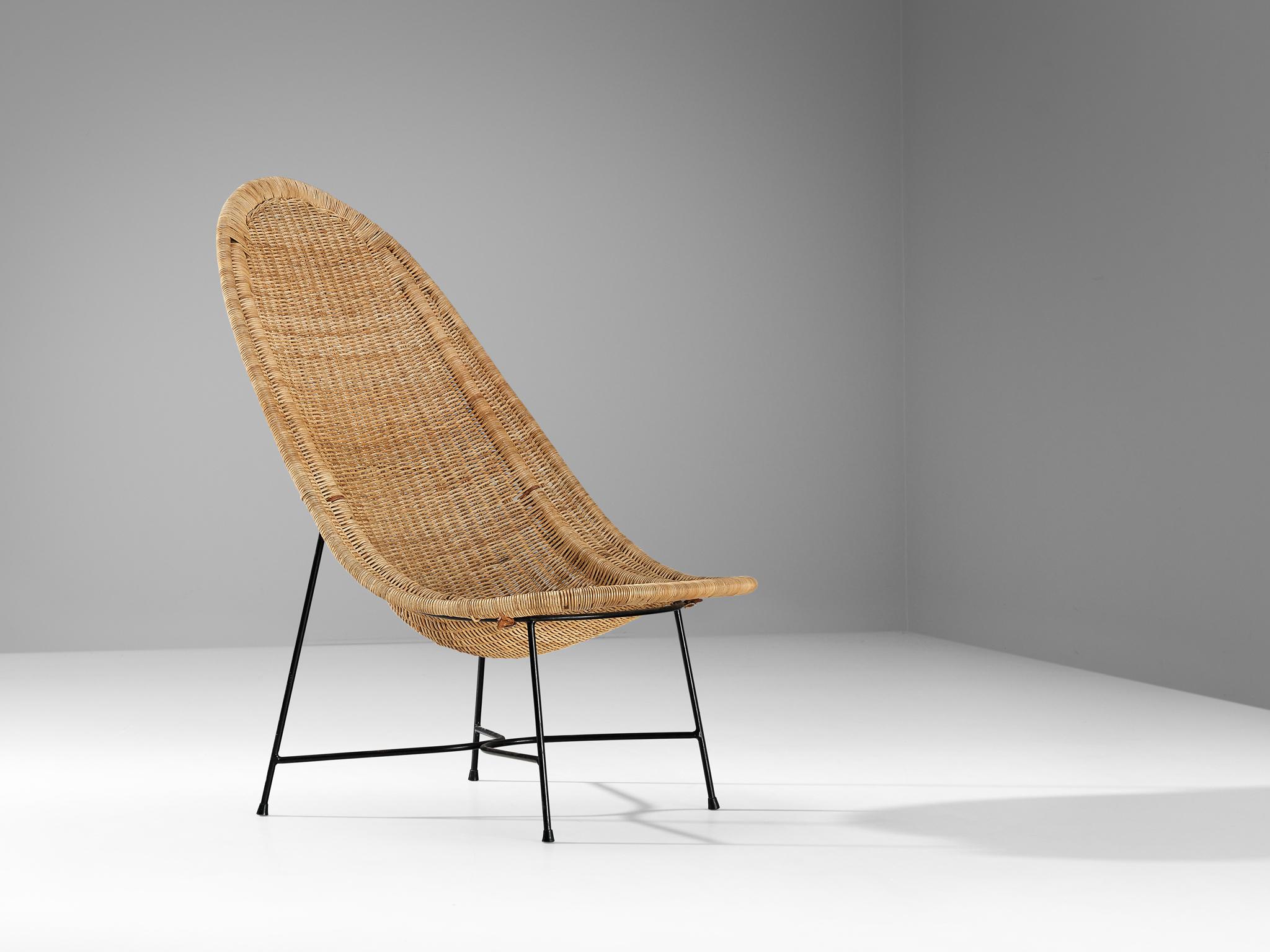 Kerstin Hörlin-Holmquist for Nordiska Kompaniet, 'Stora Kraal' lounge chair, cane, coated steel, leather, steel, rubber, Sweden, design 1952, produced 1950s

The 'Stora Kraal' easy chair was designed by Kerstin Hörlin-Holmquist in 1952 and made