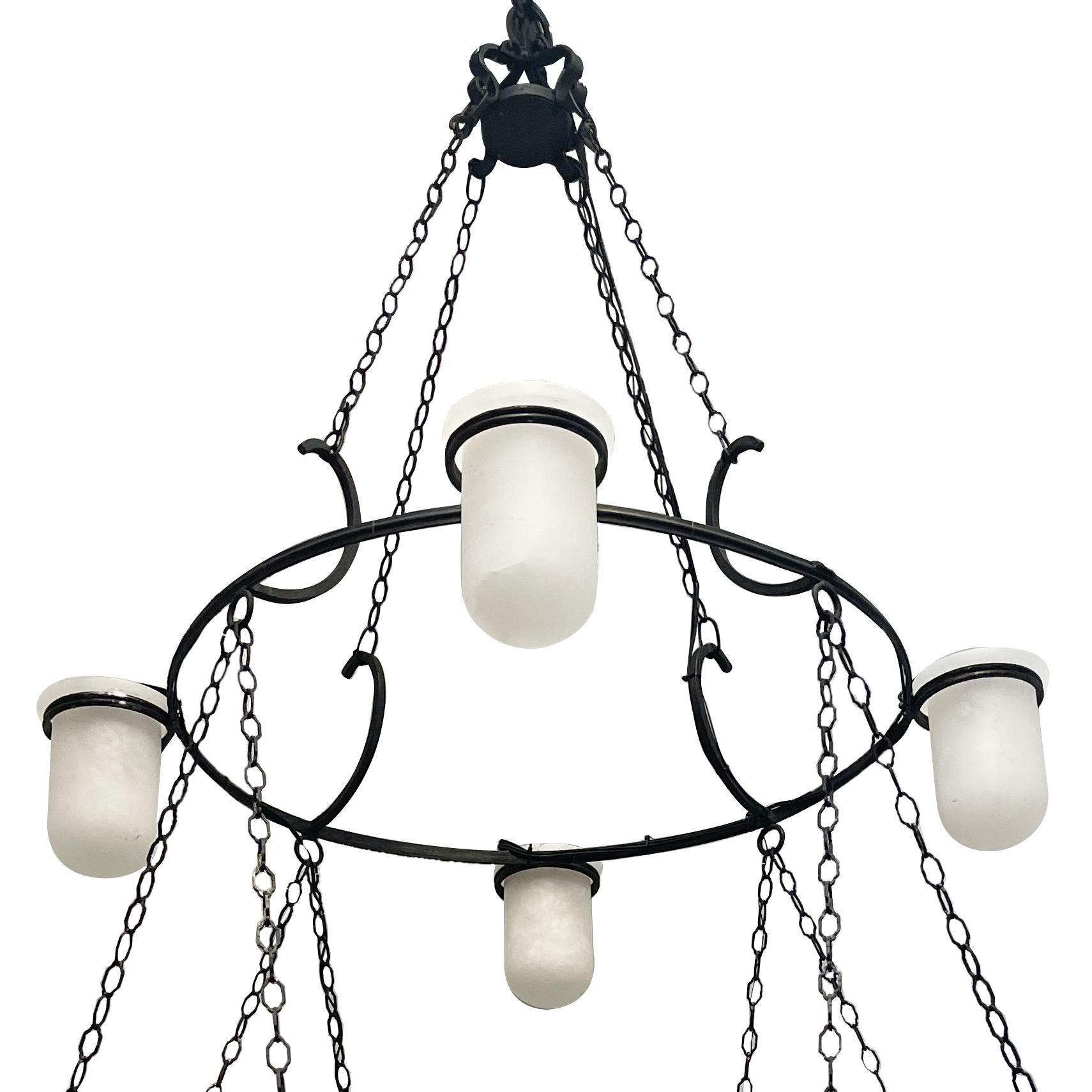 A circa 1950's Italian sixteen light bronze chandelier with carved alabaster insets.

Measurements:
Height: 58