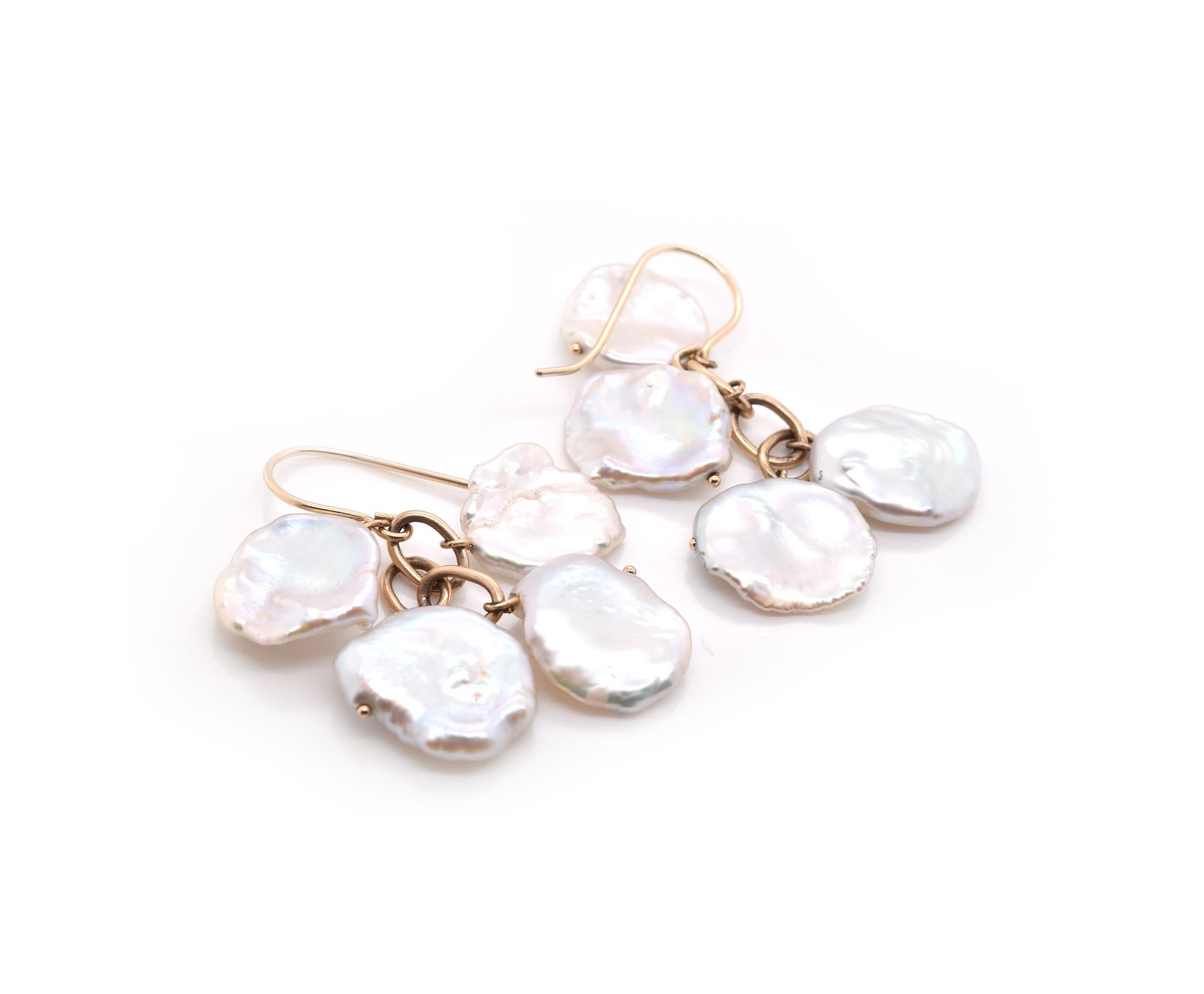 Designer: Keshi
Material: 14k yellow gold and pearl nuggets
Dimensions: the earrings measure 41.20mm in length
Weight: 6.4 grams
