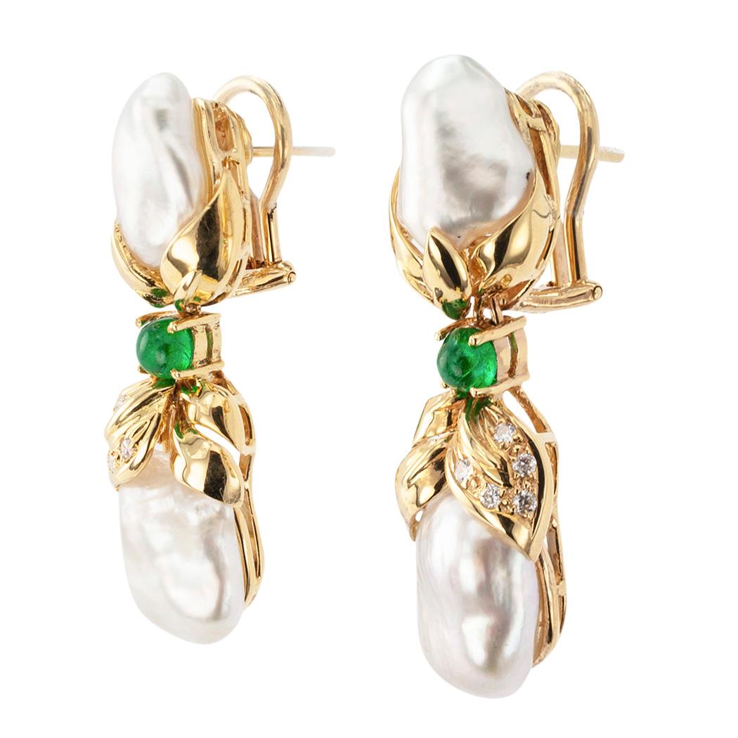 Estate Keshi cultured pearls diamond emerald and gold drop earrings circa 1990.

DETAILS:

DIAMONDS:  ten round brilliant-cut diamonds totaling approximately 0.12 carat.

GEMSTONES:  two round cabochon emeralds.

MATERIALS:  four keshi cultured
