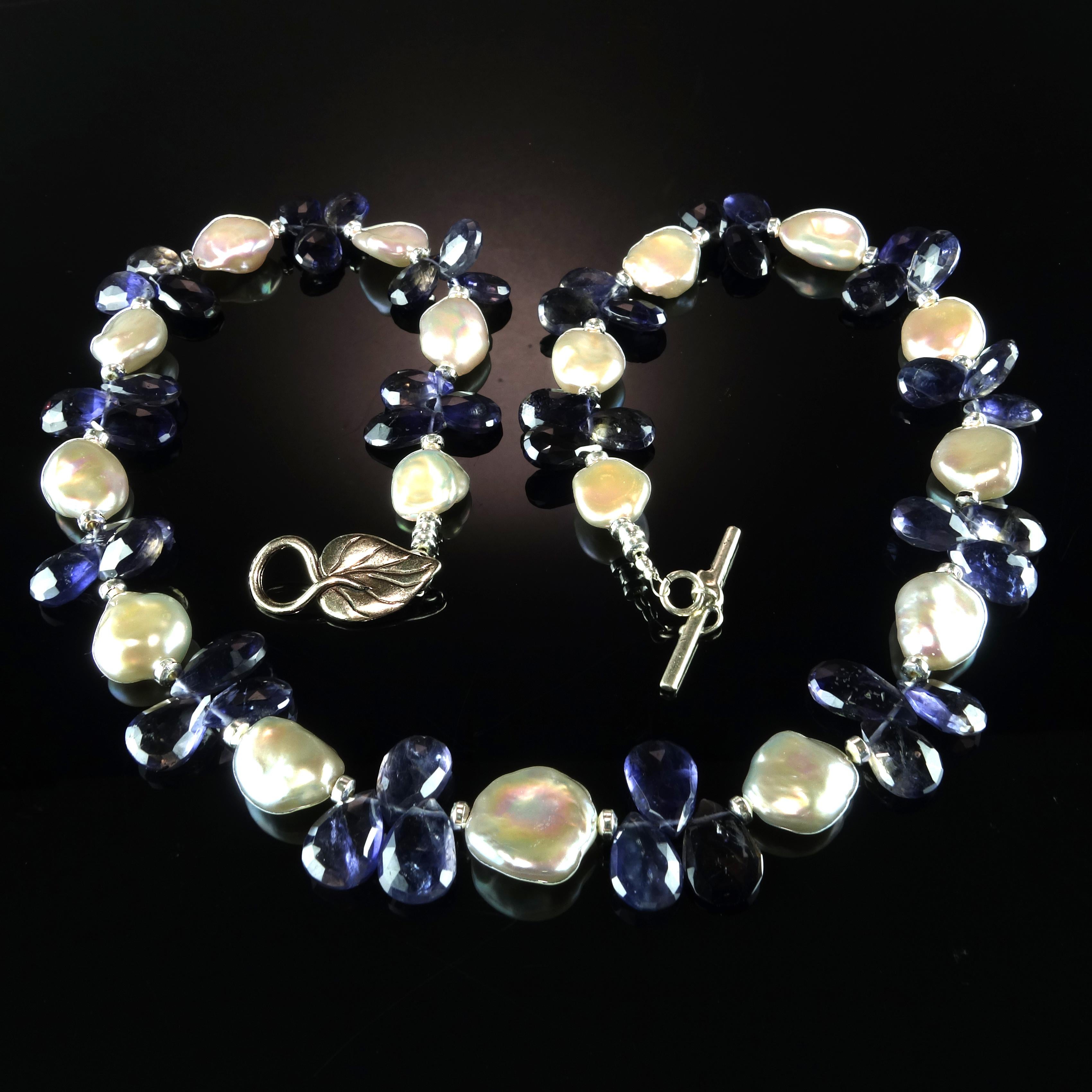 Own the jewelry you wish for

Custom made Blue Iolite Briolettes in threes accented with glowing white Keshi Pearls necklace.  This unique necklace creates a sensation, the iolites are big and bright.  Iolite is a trichroic gemstone.  It will look