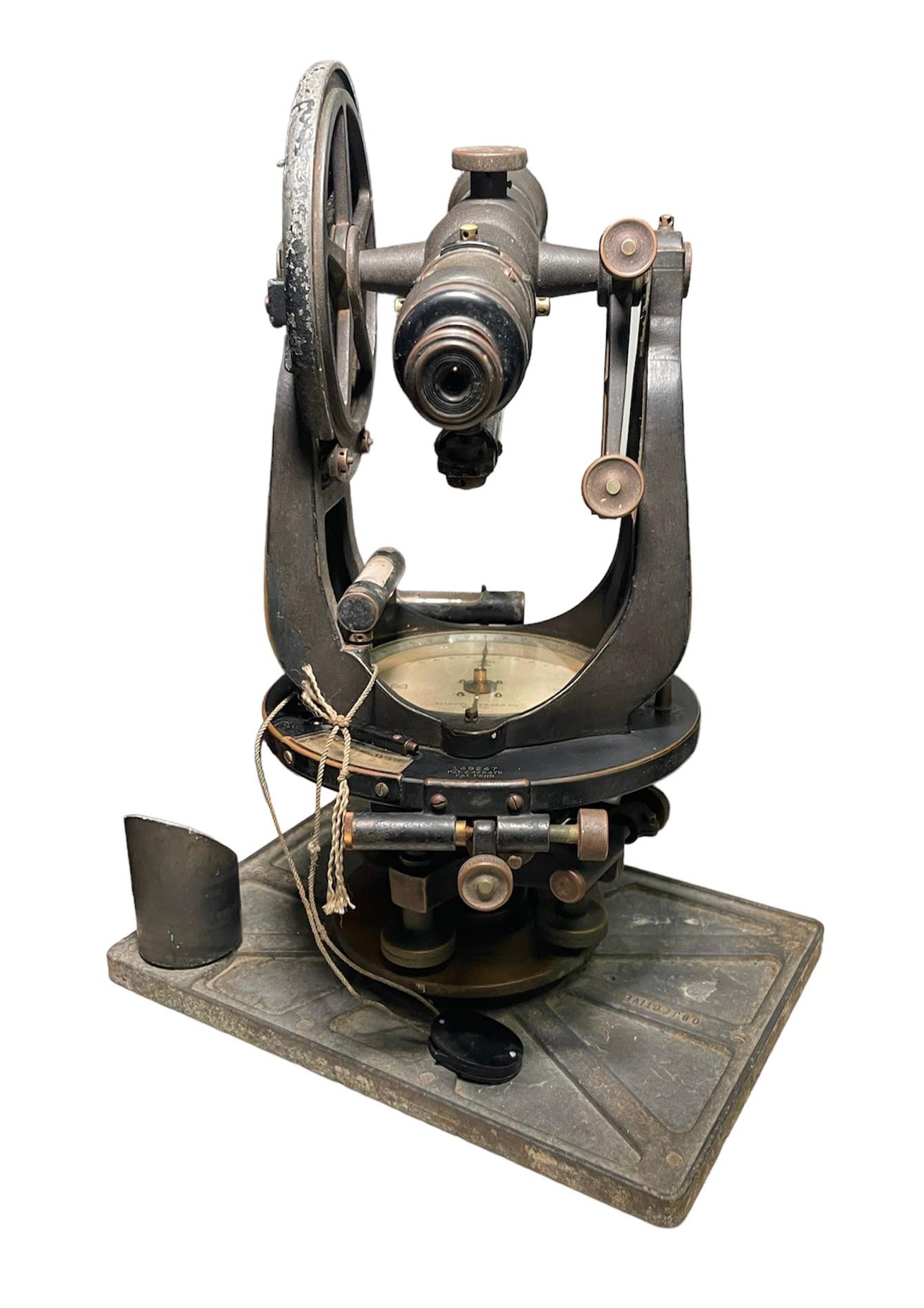 This is a Keuffel & Effer Co. military transit surveyor. It consists of a compass and a telescope. Inside the center of the compass is hallmarked Keuffel & Esser. Also over the front of the base is inscribed K&E Co.