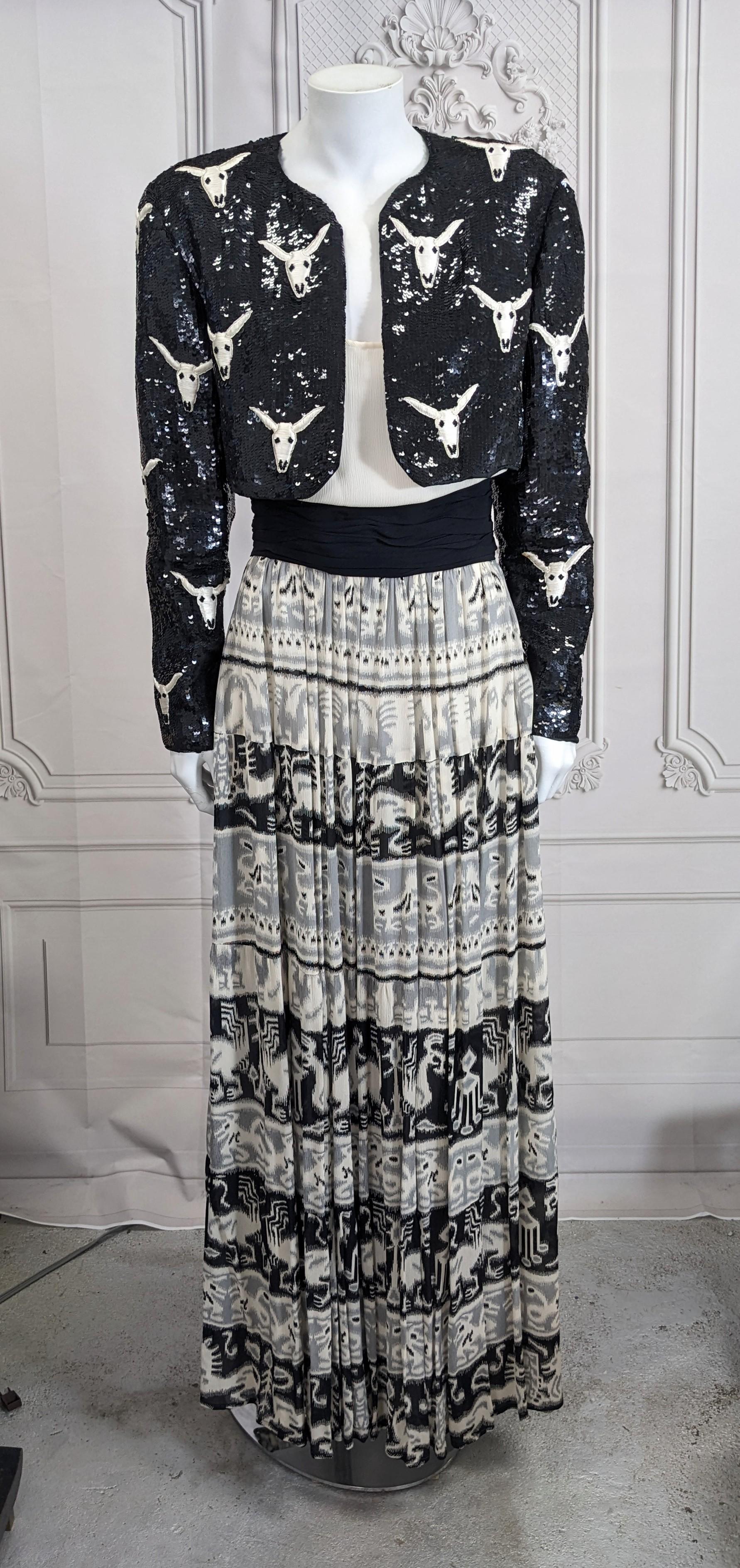 Dramatic Kevan Hall Couture Americana Themed Evening Ensemble from the 1990's. A sequin bolero with beaded and embroidered bison skulls is worn over a silk chiffon dress with native print ruffle skirt. Created by one of the few African American