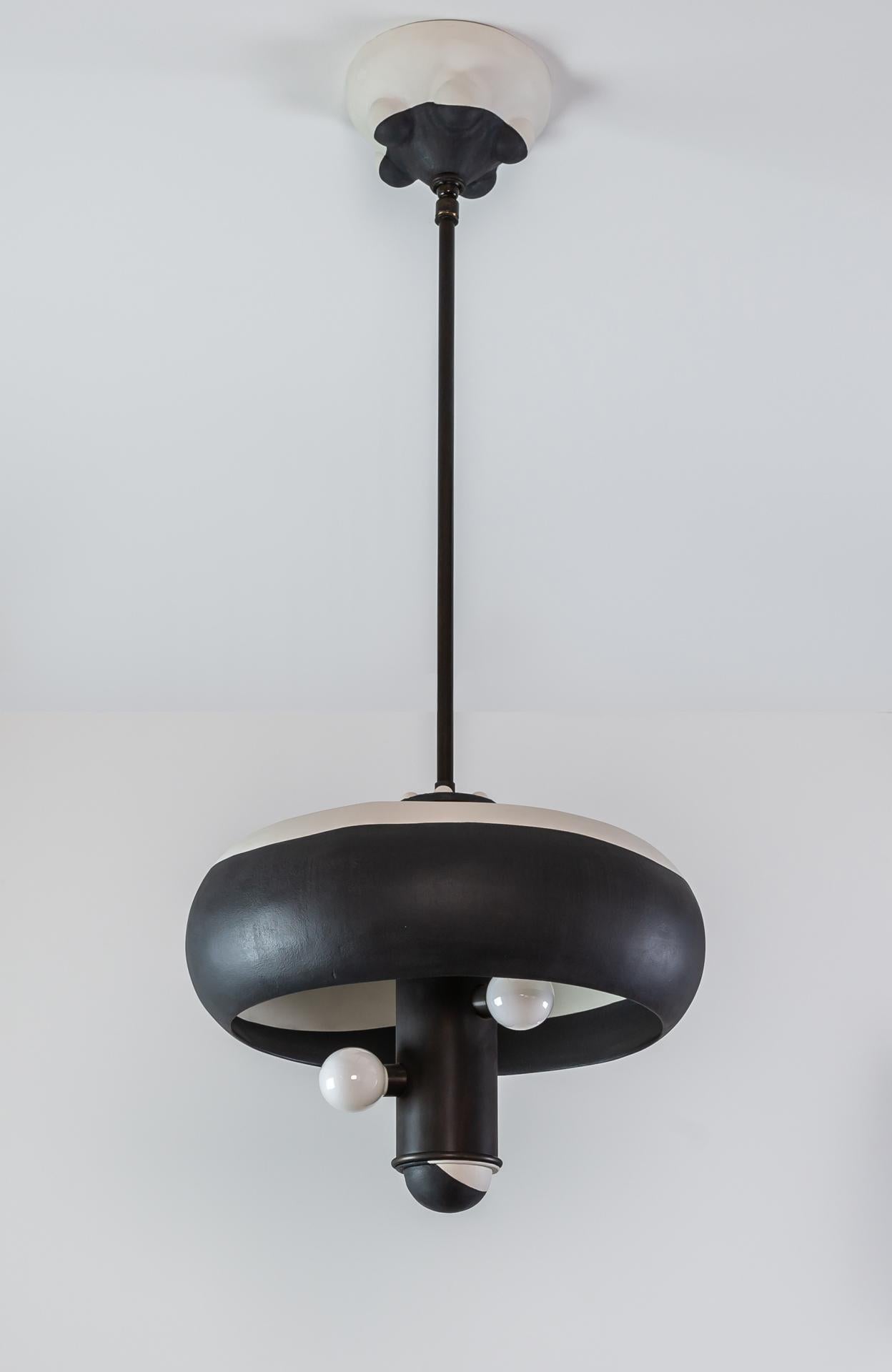 Kevin is a pendant light, part of the Posse collection; a system designed around the core ideas of collaboration and play.



The pendant is created to give the customer freedom in tailoring their own expression. The design is centered around a