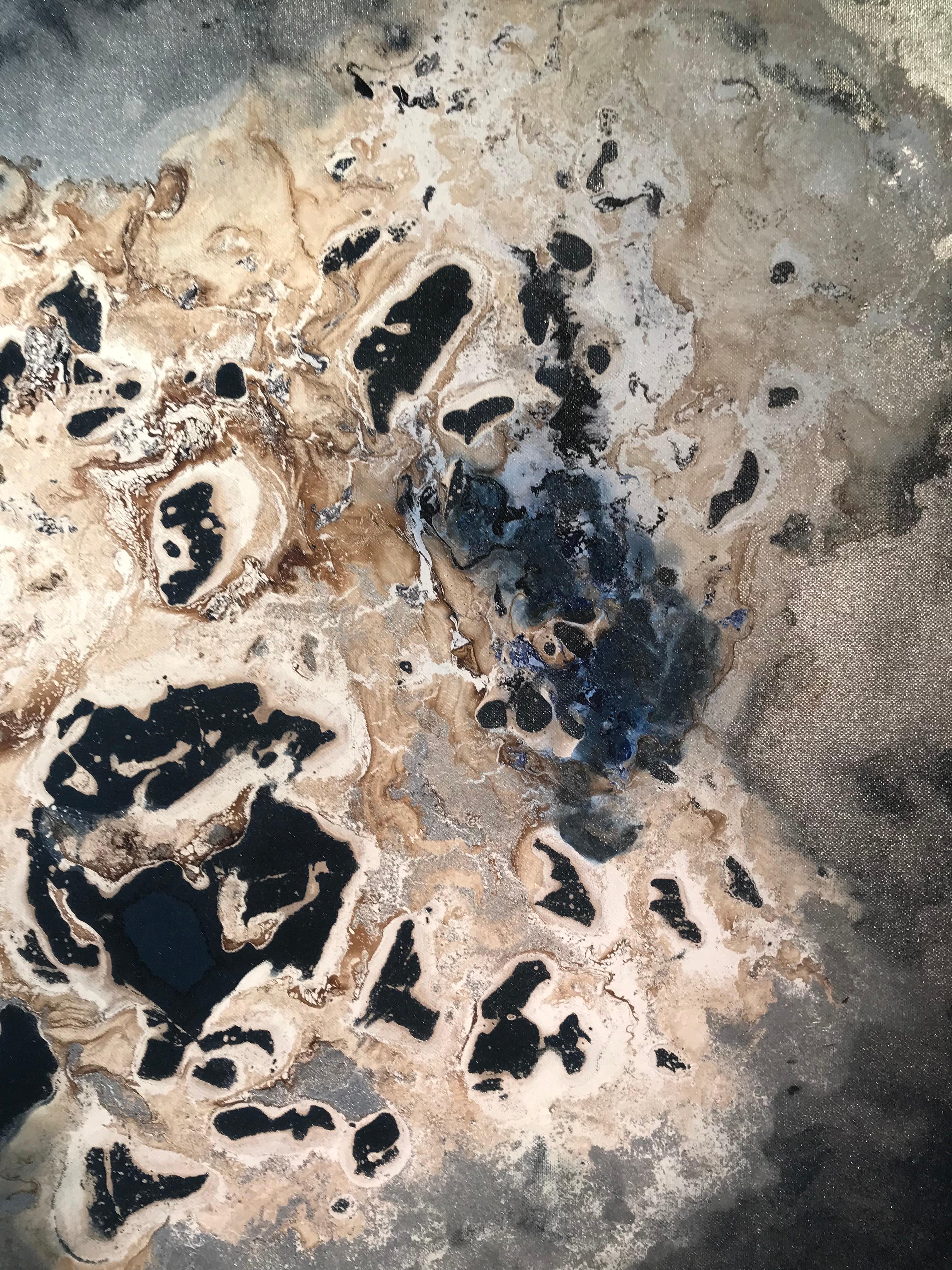 'Geode' by Kevin Burton is a mixed media contemporary abstract painting. Silver and gold create a atmospheric and interesting composition. The dark blue undertones make the piece strong and bold. 

The use of mixed media is visually interesting and