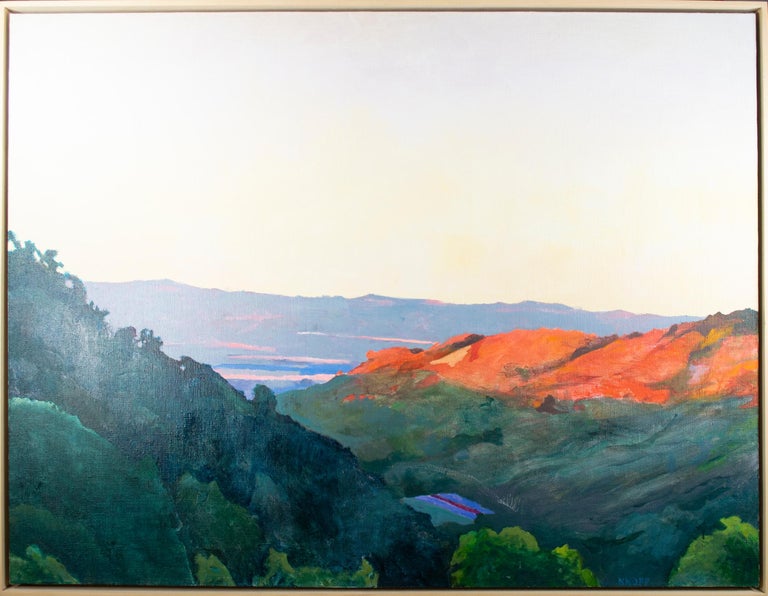 'King's Bluff, La Crosse' is an original landscape in oil signed by the Midwestern artist Kevin Knopp. In the vista, mountains jutt out from either side of the canvas in deep greens and oranges. In the far distance, beyond the hills, the sky reaches