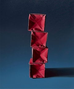 PAPER BOXES: COMPOSITION WITH A MAGENTA STACK ON BLUE/GRAY GRADIENT