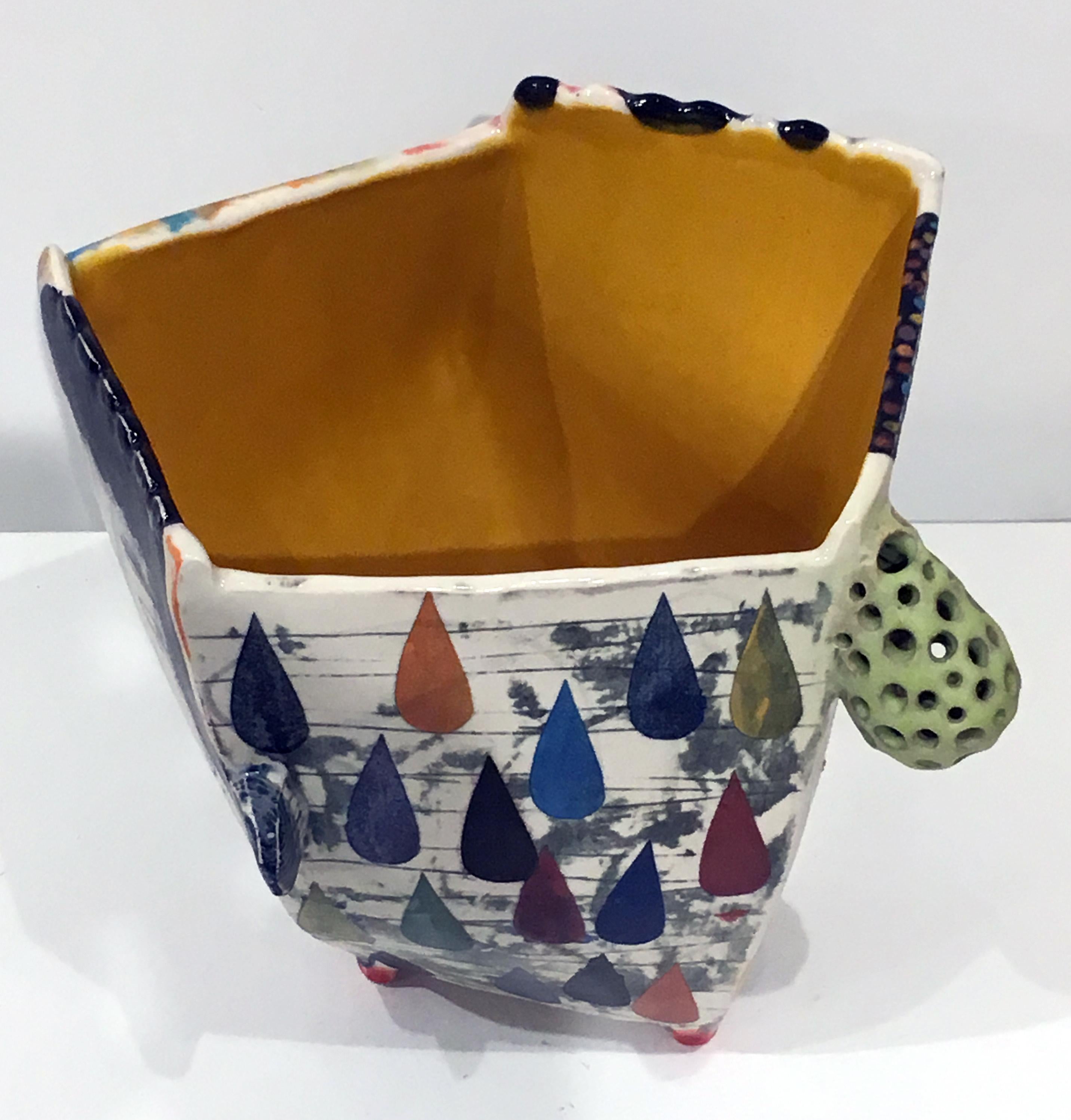 Kevin Snipes creates ceramic vessel forms that act as canvases for self referential narratives that are brought to the viewer through a combination of illustration and symbolism, obscure glyphs, and comical/whimsical motifs. Within the discipline of