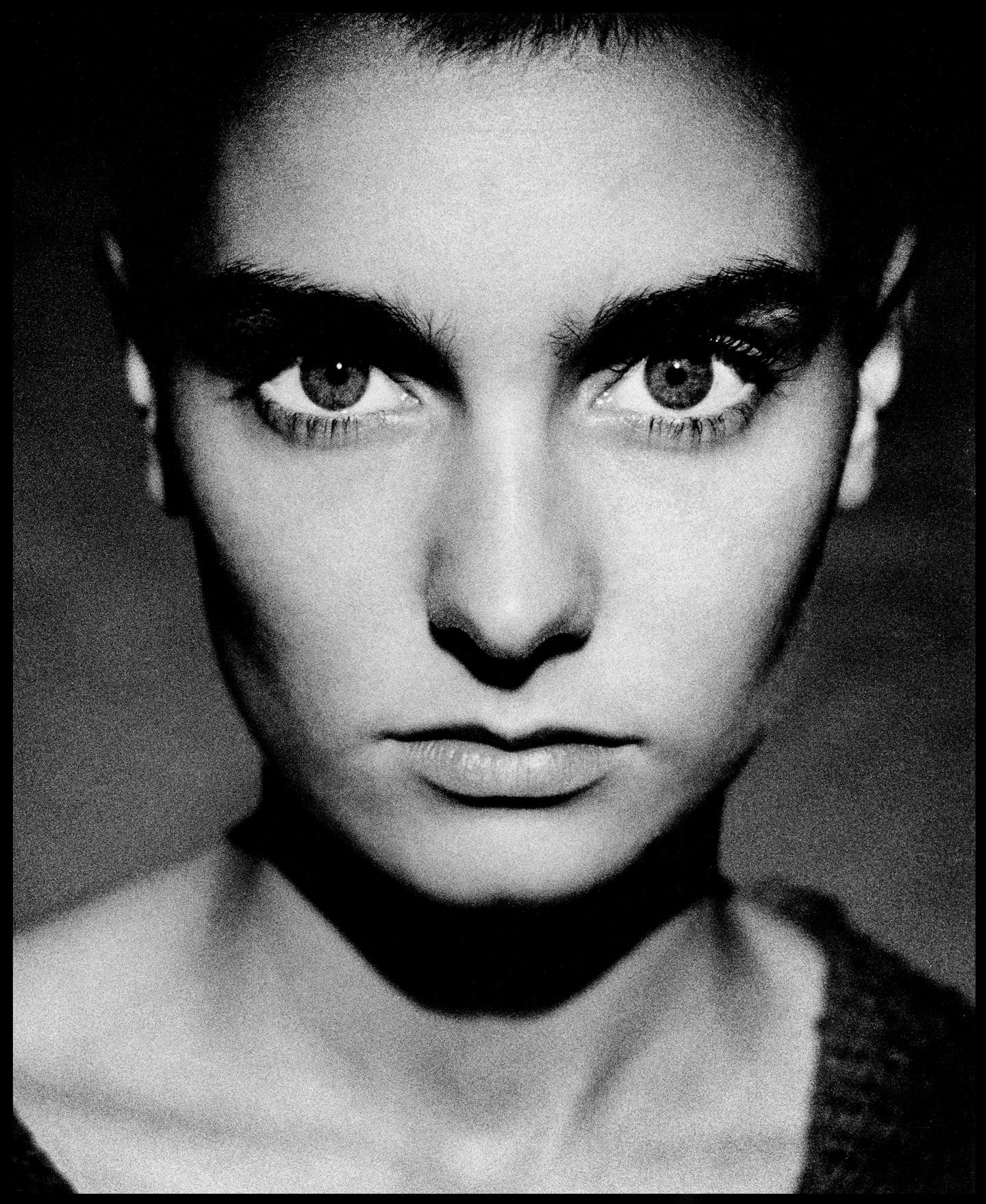 Sinead O'Connor 

1990 

by Kevin Westenberg

Kevin Westenberg is famed for his creation of provocative and electrifying images of world-class musicians, artists and movie stars for over 25 years. 

His technique of lighting, colour and composition