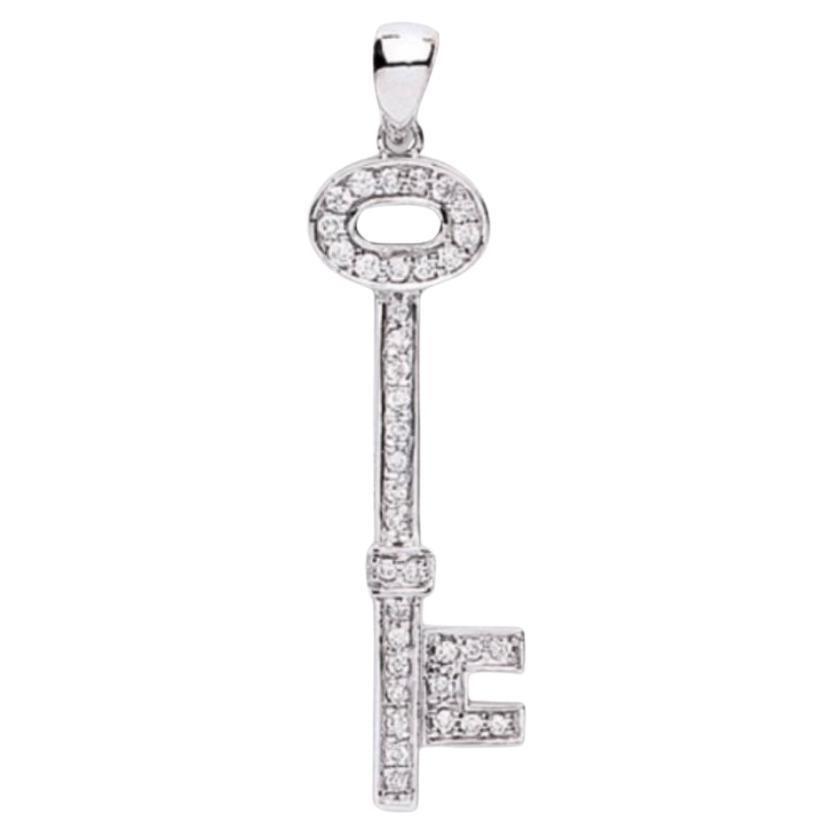 Key necklace in white gold with diamonds en venta
