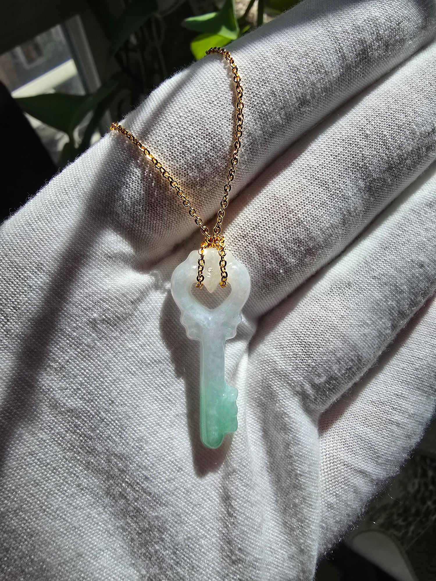 The Key of Paris Burmese Green and Lavender A-Jade Charm Pendant is made from handpicking bi-tone Burmese A-Jadeite, with great hues and optics. The iconic Key design has a heart shaped top representing the City of Love, Paris. With vibrant optics