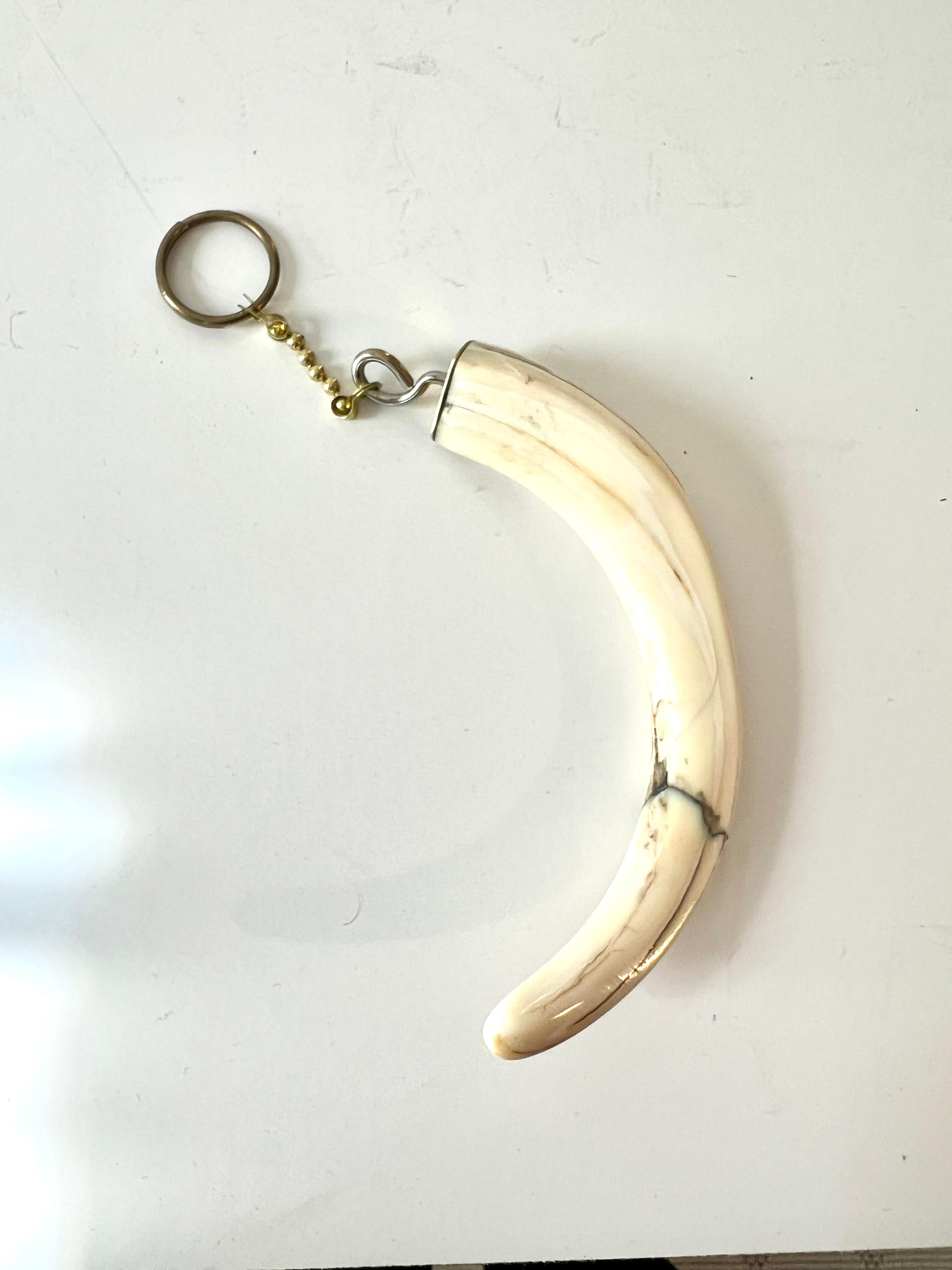 A Polished piece of bone with a brass key ring attached.  This piece is unusual and wonderful all at the same time.  Animal Bones Bring with them good energy and protection.

Bones includes beliefs about their use in divination, art, and rituals, as