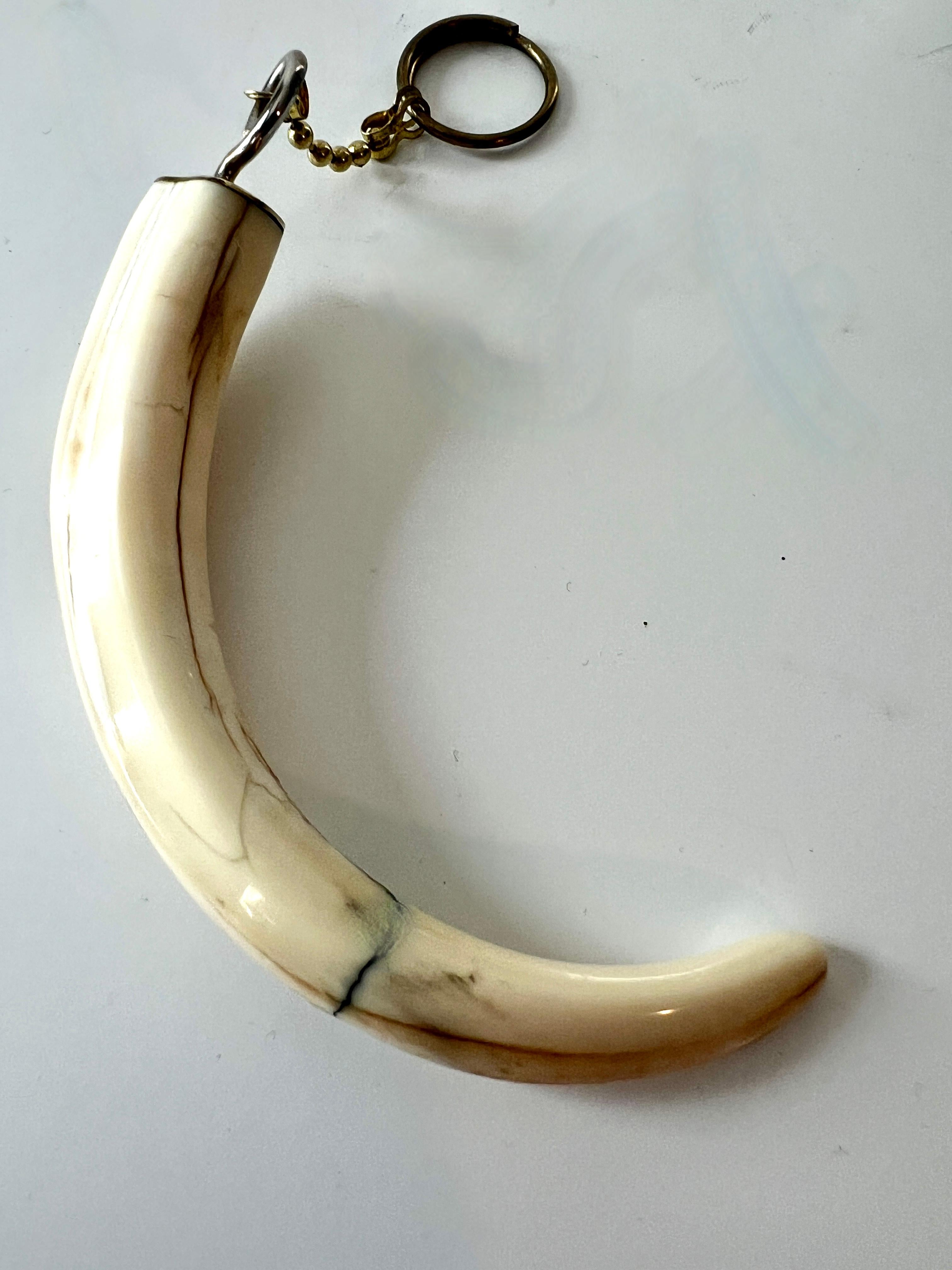 Brass Key Ring with Attached Piece of Bone For Sale