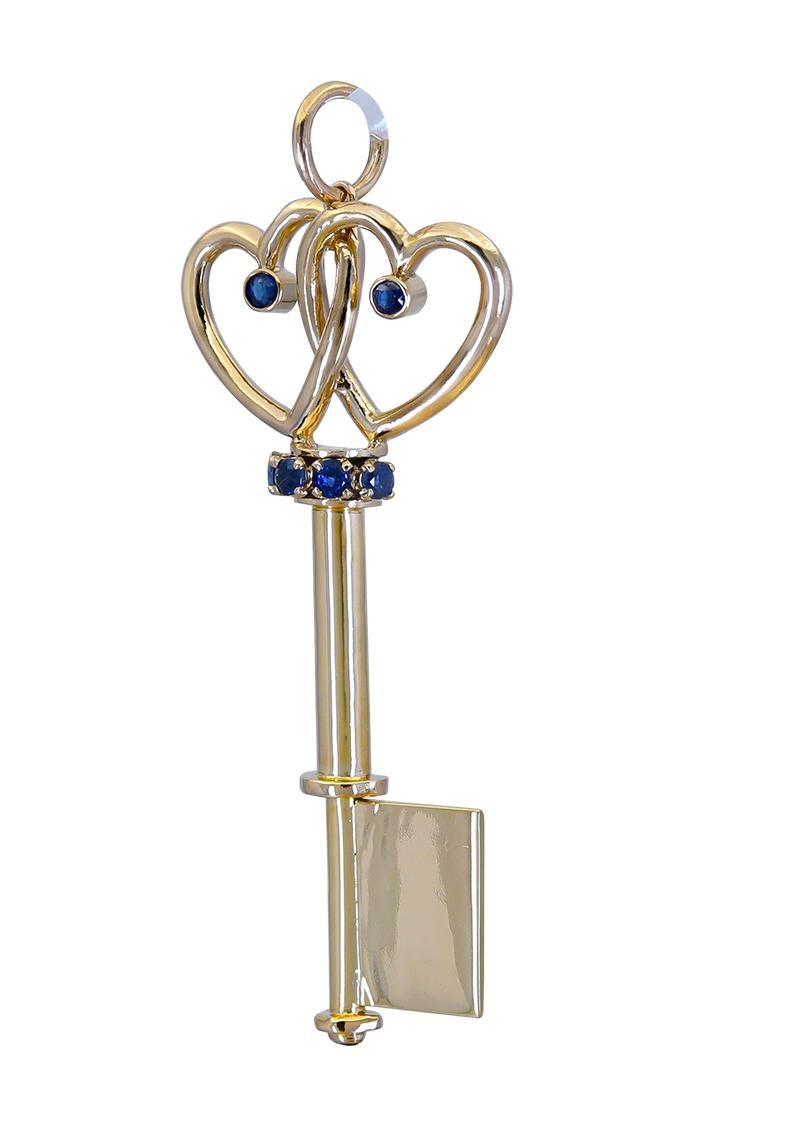 True Romance: A solid 14K three-dimensional figural key pendant.  Two intertwined 