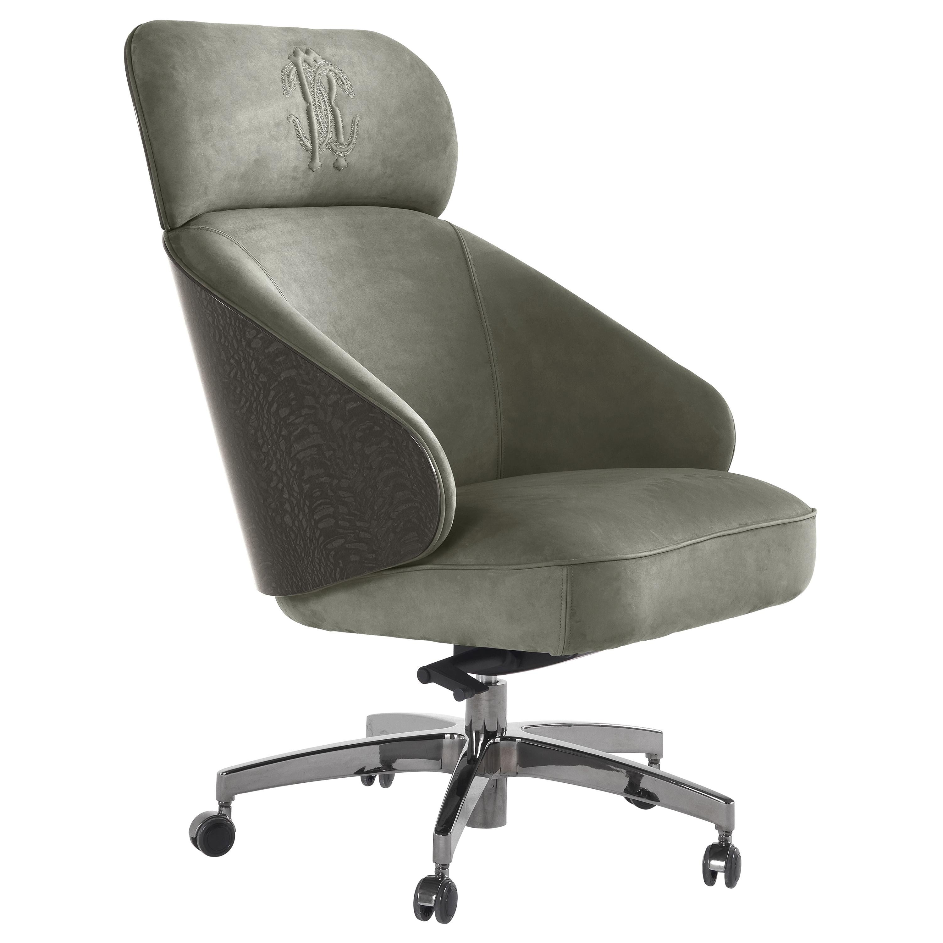 Key West Swivel armchair with Structure in multi-layer wood and foam. Upholstery in leather CAT. B Nabuk Col. Musk Green with eRc snake embroidery. Back in glossy Carbalho grey color. Adjustable swivel base in metal black chrome finishing.