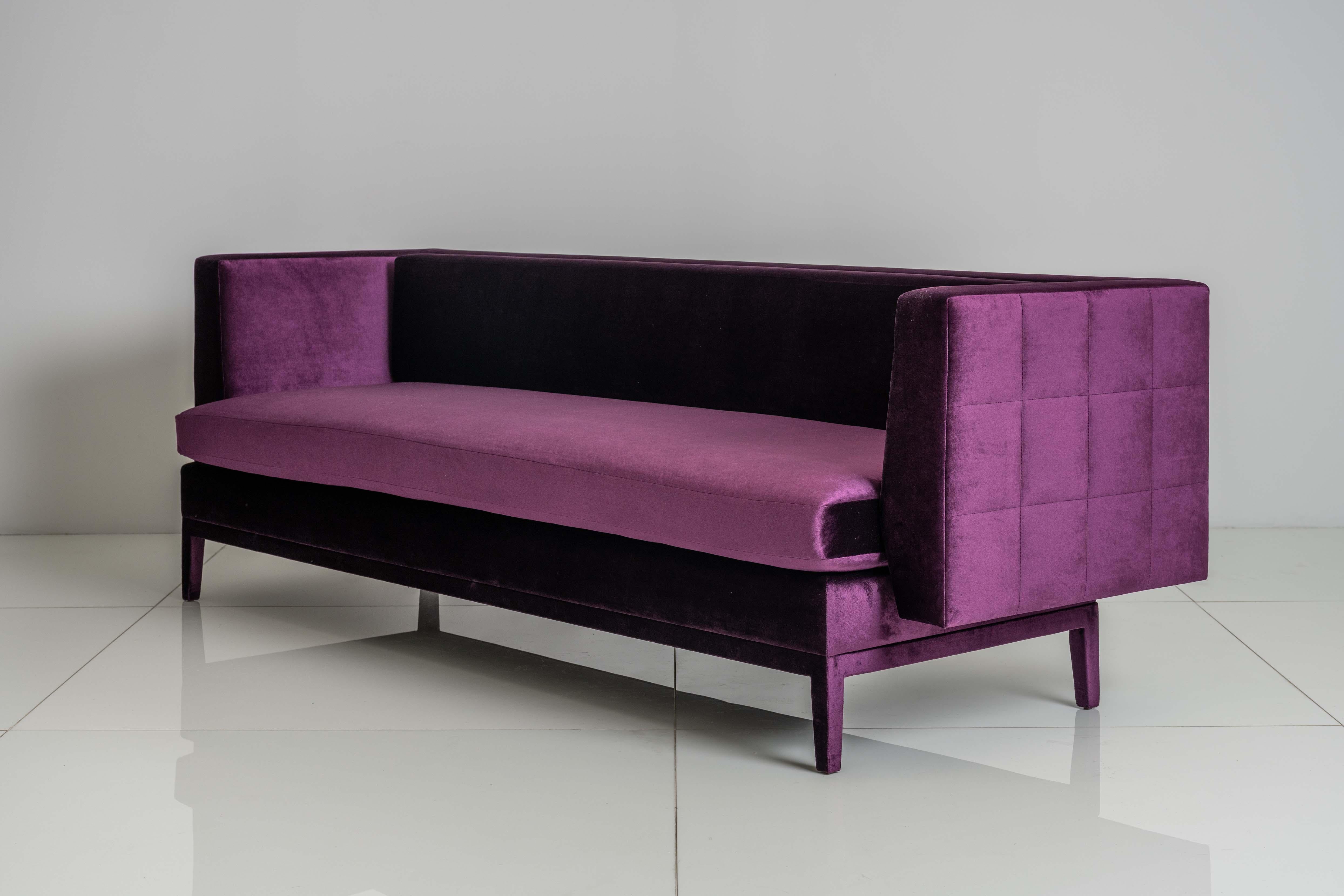 The Liston Sofa was conceived and executed as a fully upholstered piece, including the legs, to give it a unity of form. Arms and back float away from the seat. This 2.0 version includes a loose bench seat cushion and semi-attached back cushion. The