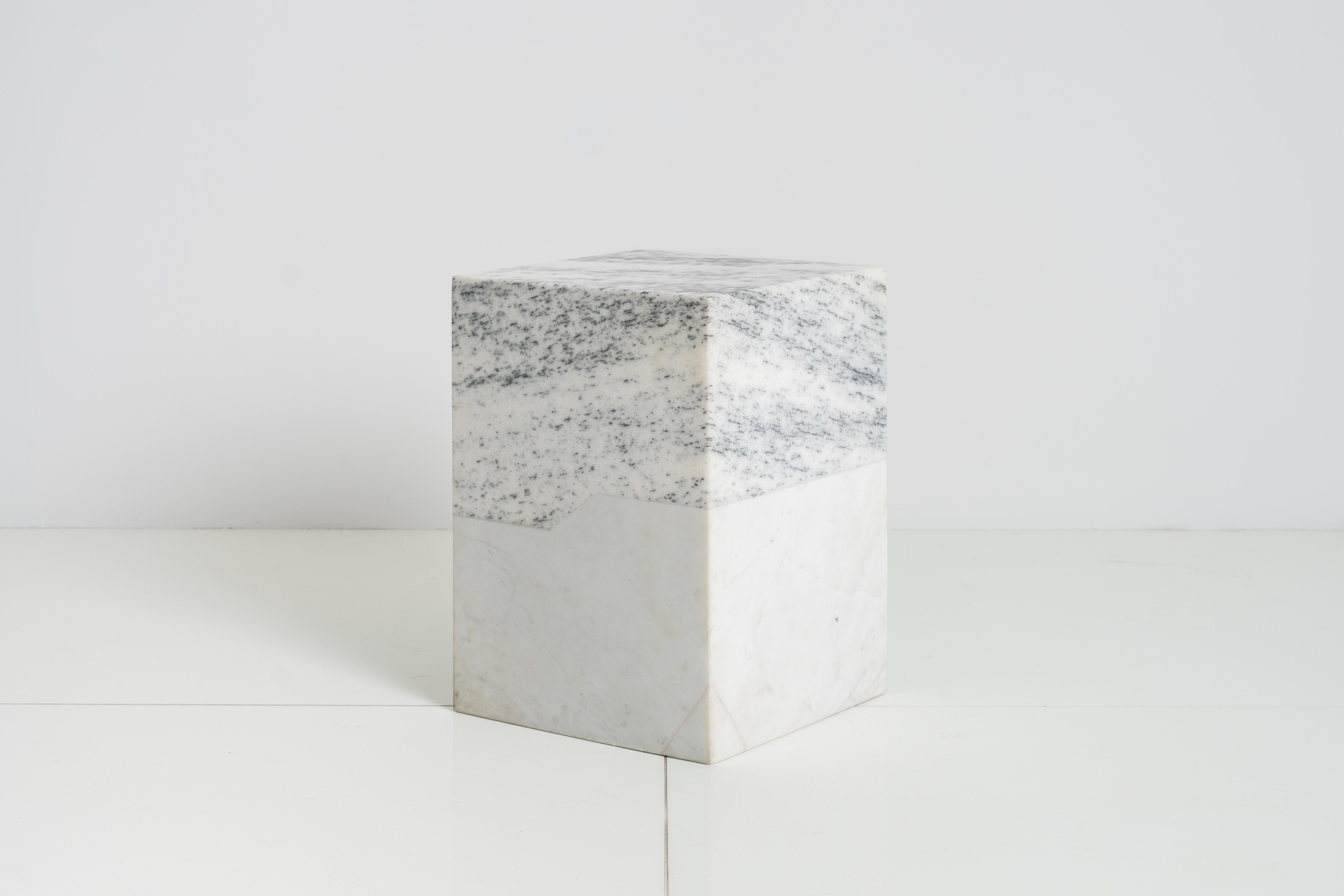 Two interlocking pieces of solid marble create the archetypal mass of the Terrell Side Table. 

Each piece of marble is unique and may have different variations in design from what is pictured. This is the beauty of the product and makes it unique