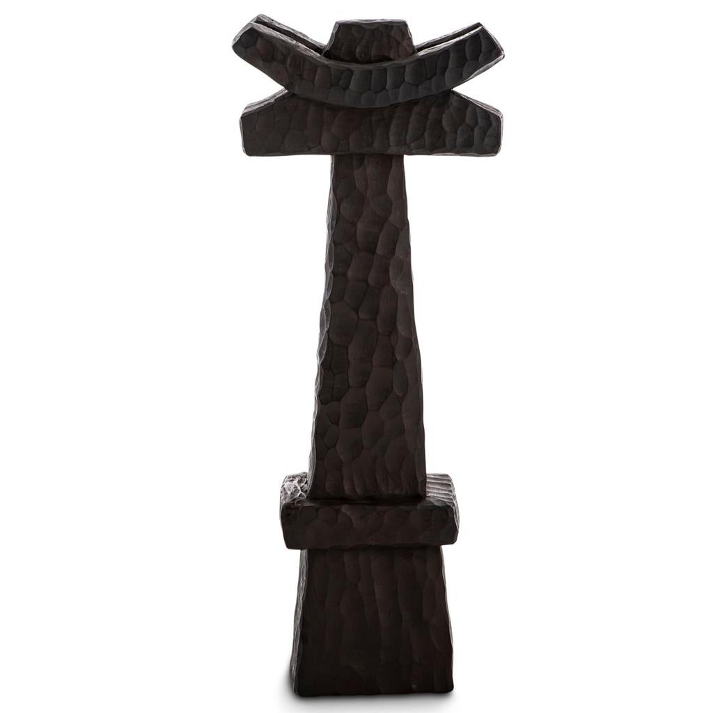 The Khada Totem Sculpture #1 is hand-carved in Southern Africa from sustainable alien timber by a collective of Zimbabwean artisans, who set their own prices, ensuring each piece is fair trade. 
These sculptural forms evoke a primal, brutalist