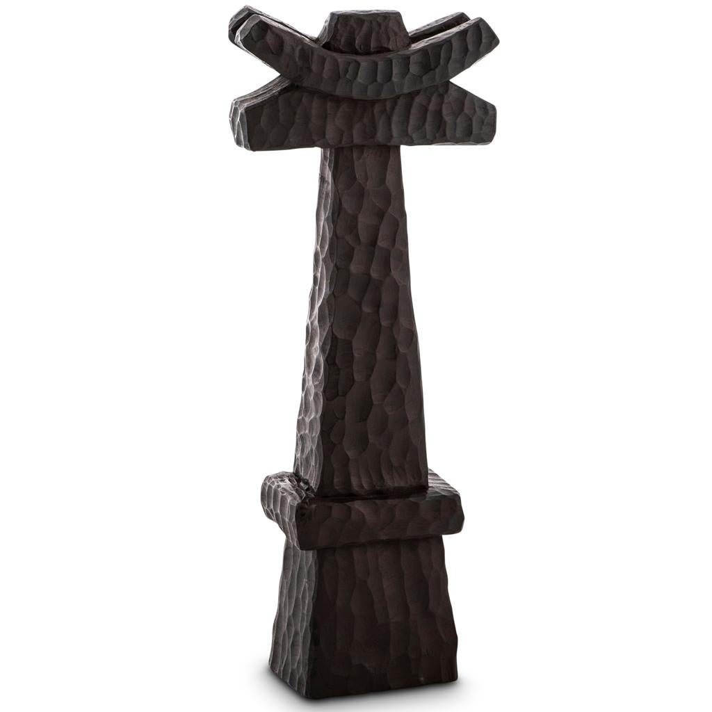 All our totem sculptures are hand carved in Southern Africa from sustainable alien timber by a group of Zimbabwean artists who set their own prices, thus making them fair trade. 

These sculptures have a strong African, primal and Brutalist