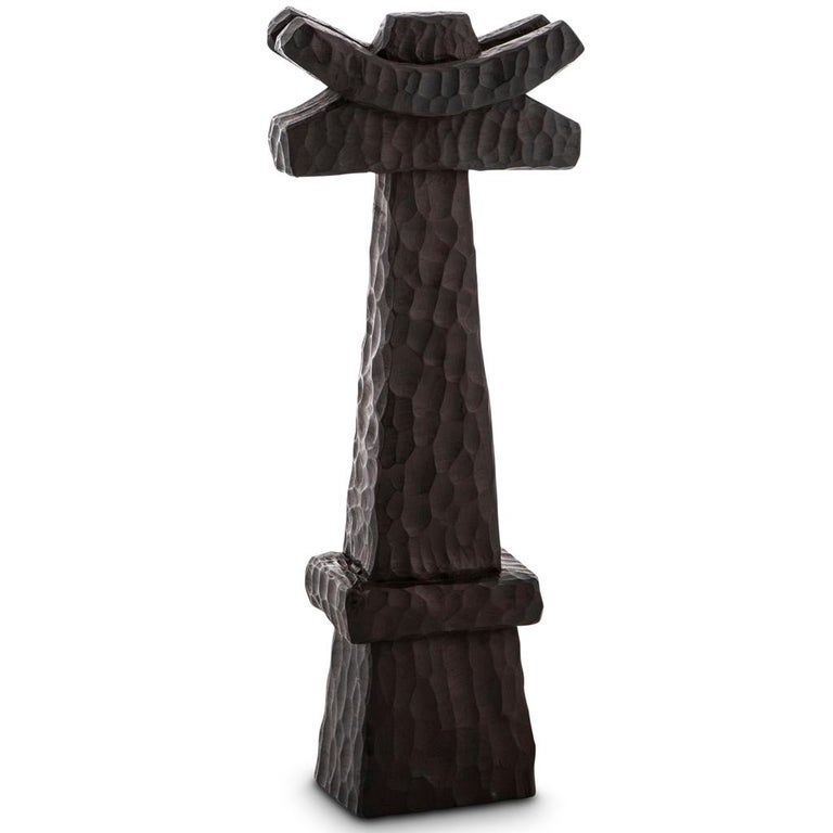 All our totem sculptures are hand carved in Southern Africa from sustainable alien timber by a group of Zimbabwean artists who set their own prices, thus making them fair trade. 

These sculptures have a strong African, primal and Brutalist