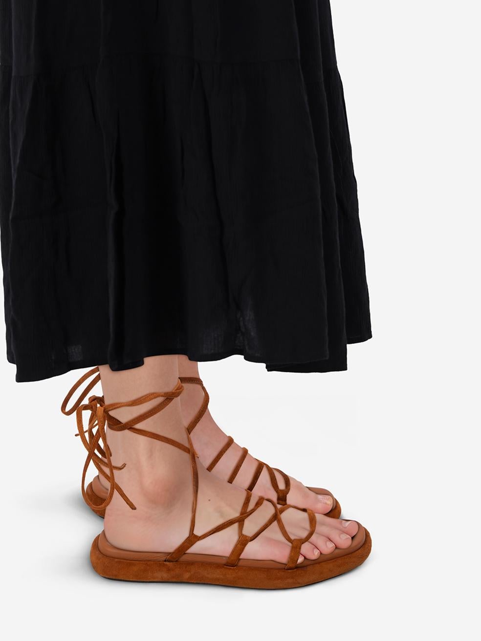 CONDITION is Very good. Minimal wear to the sandals is evident. Abrasion on the rim of both soles. Marks on the lace-up detailing on both shoes. Dent on the right insole on this used Khaite designer resale item. This pair of shoes comes in the